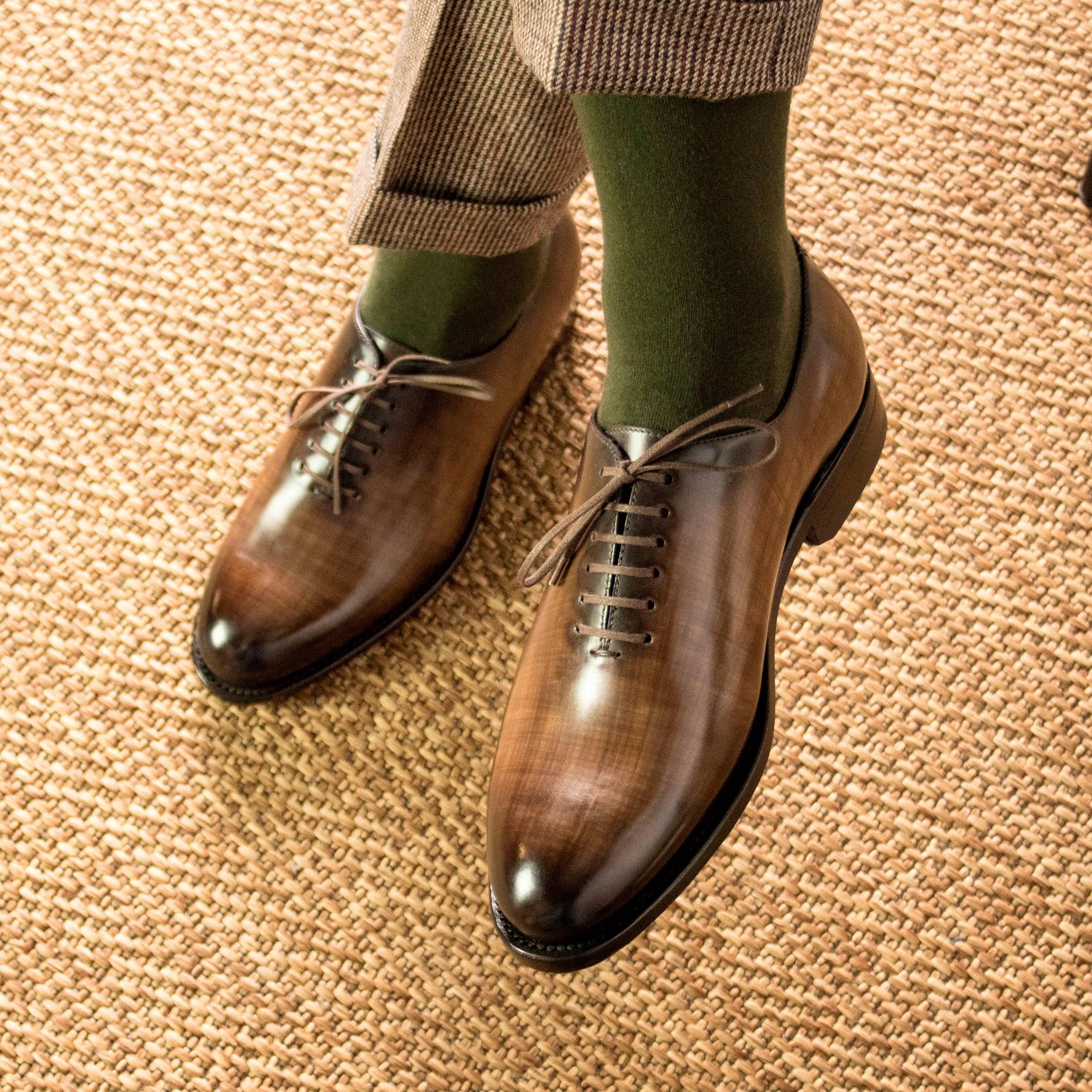 Brown leather dress shoes, featuring the elegant Mozart Patina Wholecut design