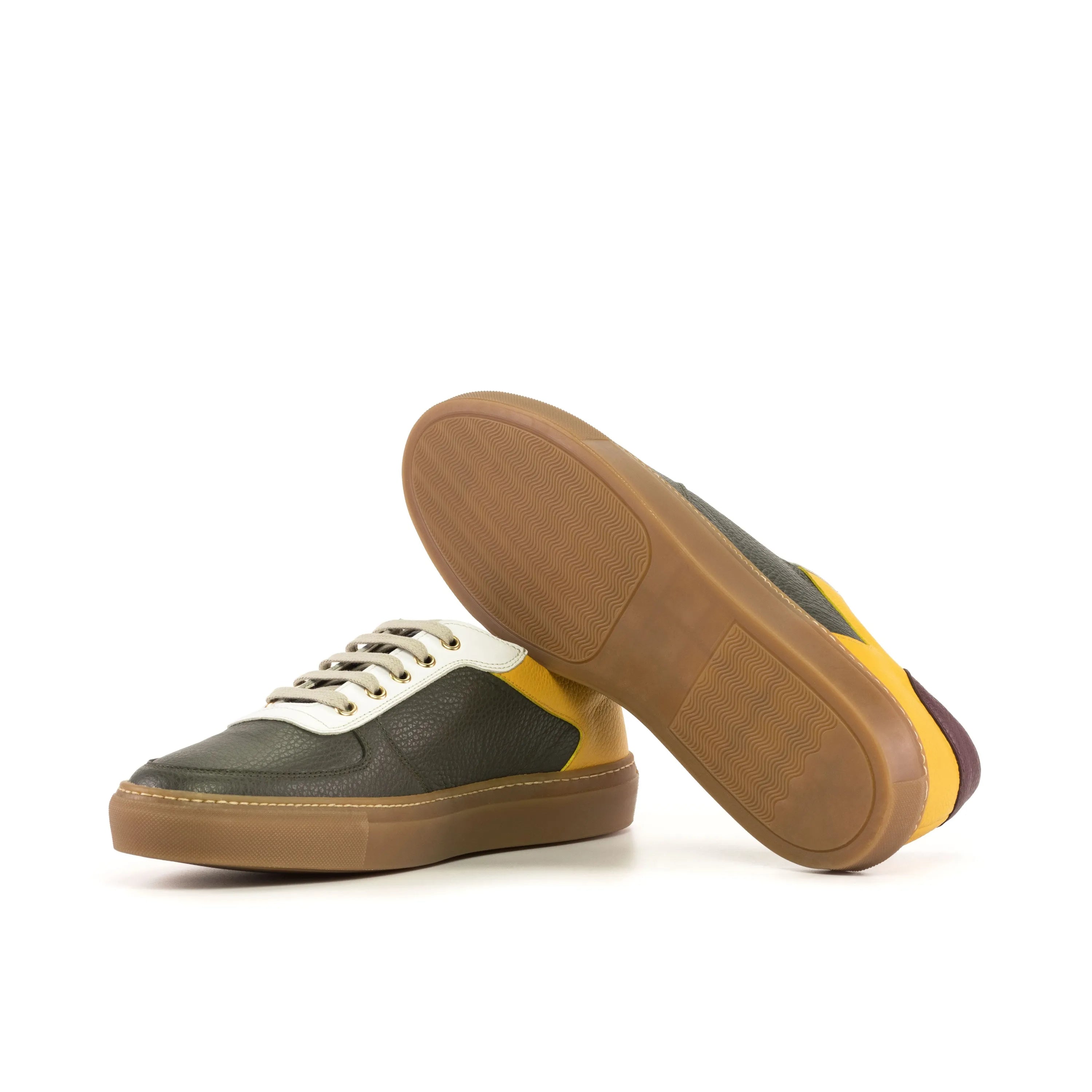 Two leather sneakers showcasing the MuhammadAli Trainer Sneaker in grain calf leather