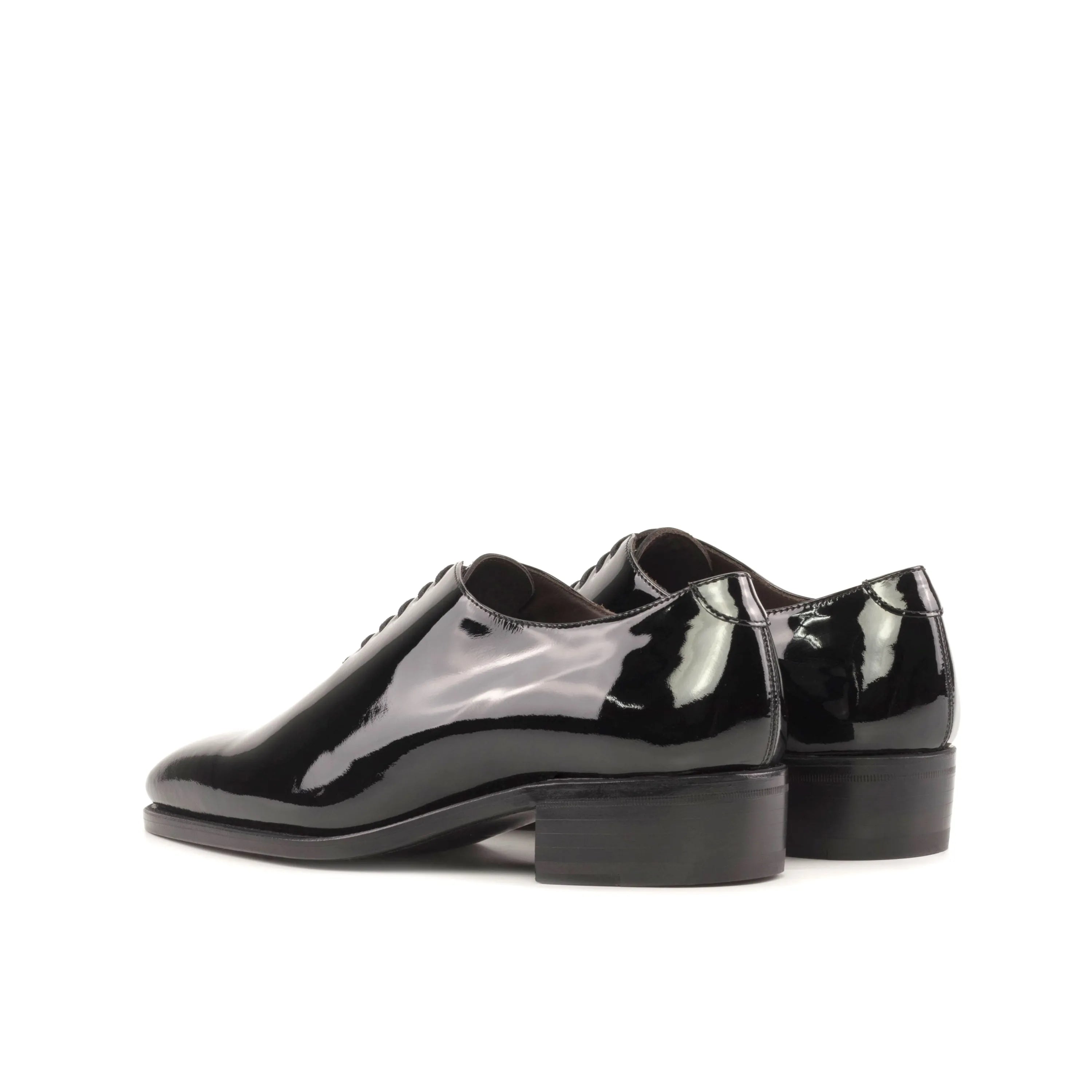 Pair of shiny black Narciso Wholecut shoes, the epitome of elegance and style