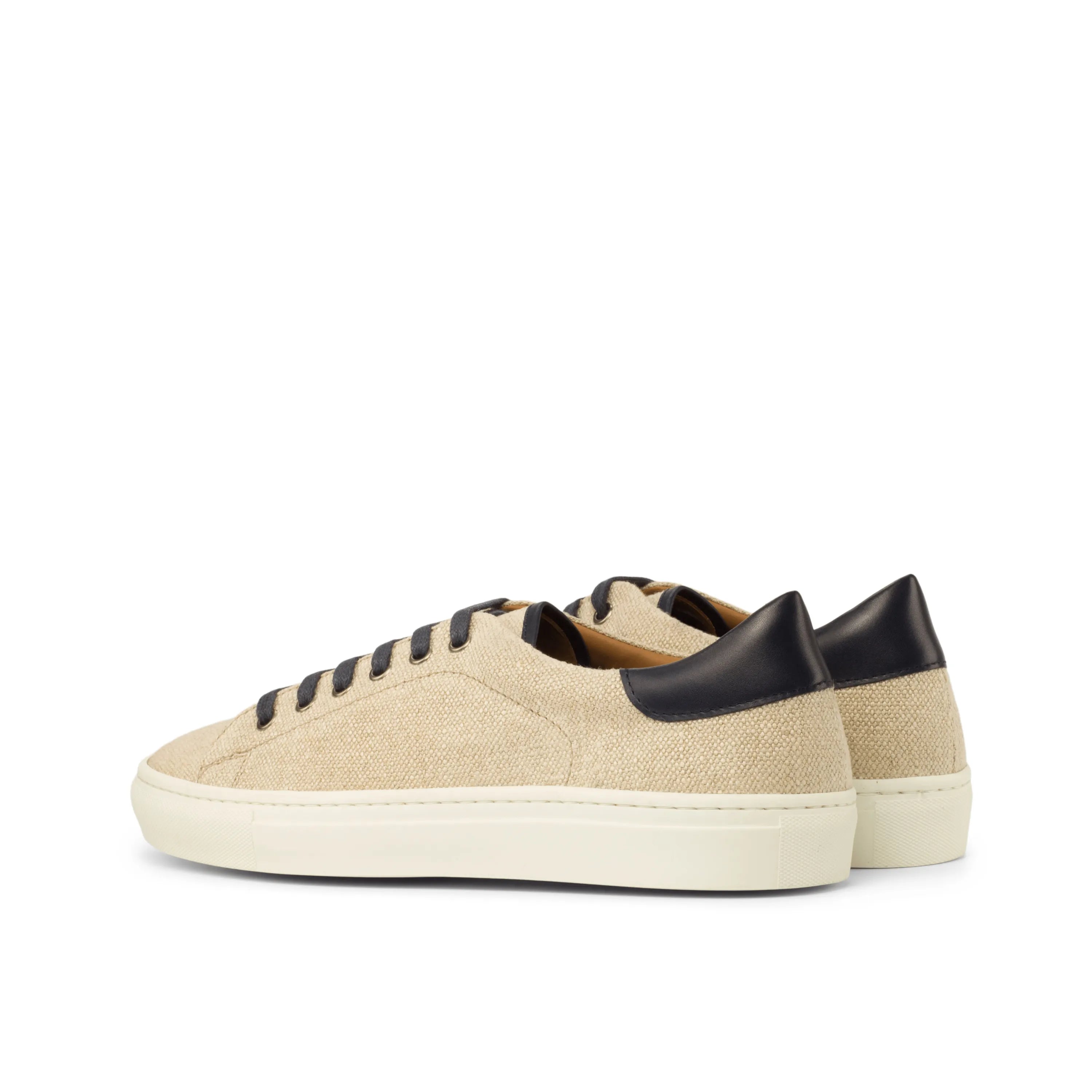 Beige canvas Nastas Top Sider Sneaker with black accents, perfect as a cupsole trainer