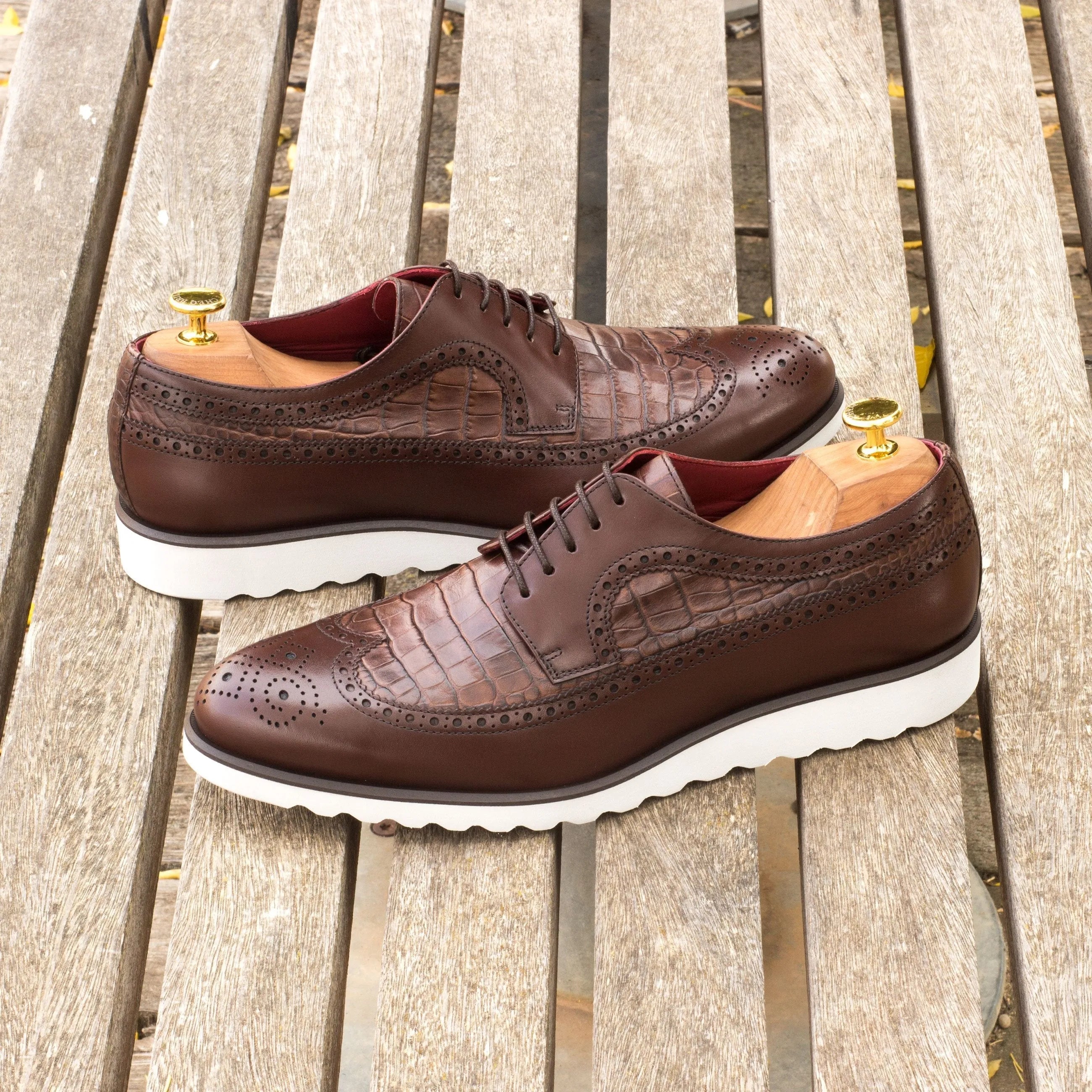 Brown leather wingtip shoes showcasing the Nevada Longwing Blucher design