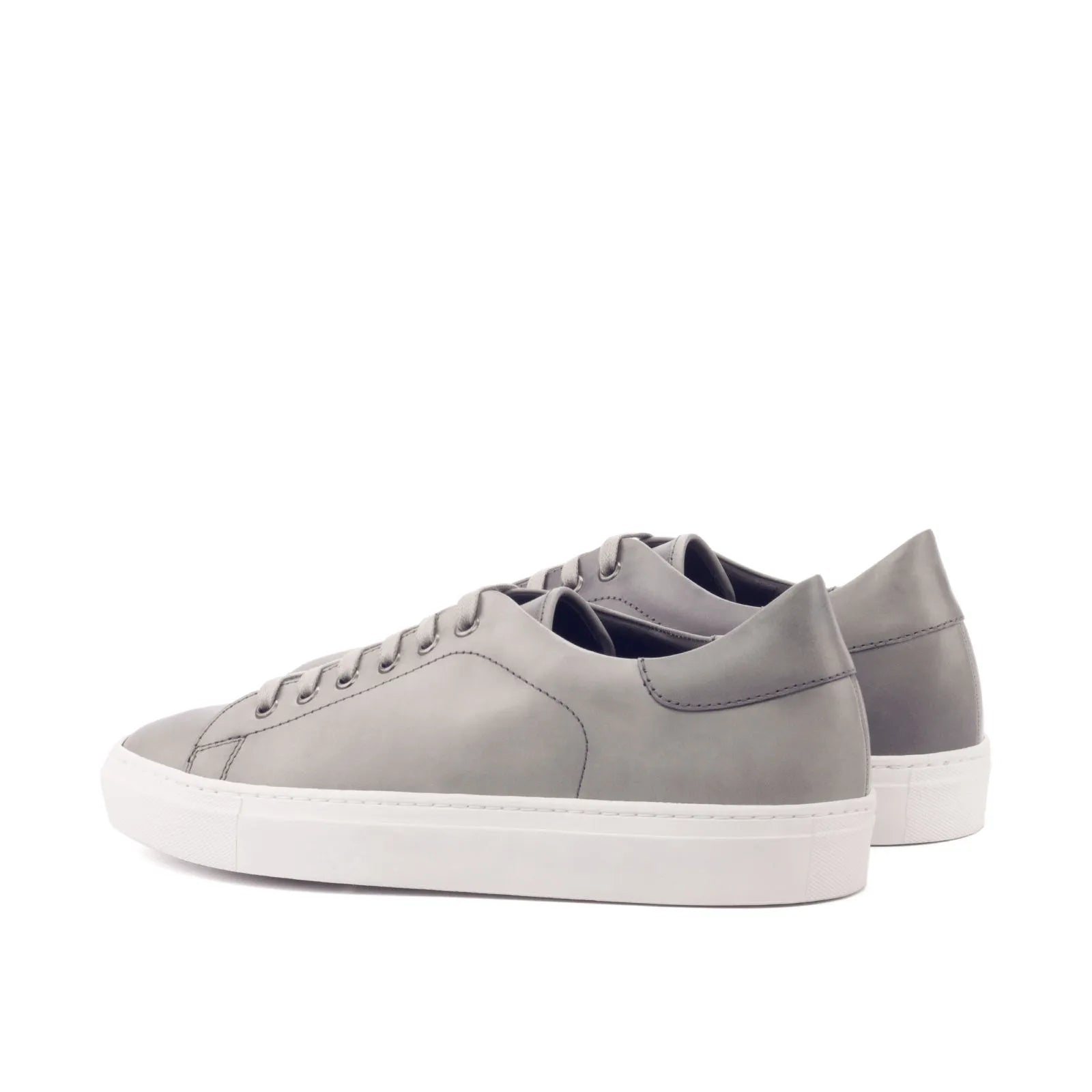 Gray leather sneakers in the Nicholas Trainer Sneaker style with cupsole design