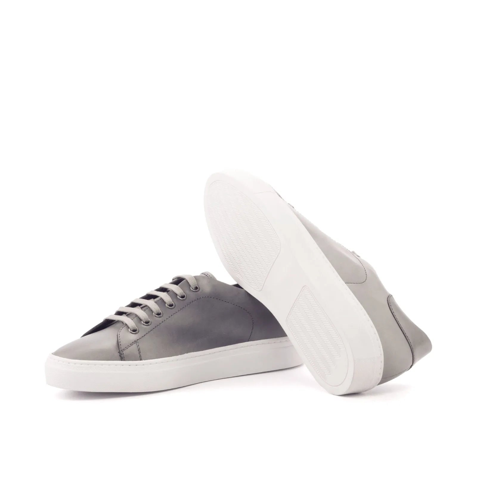 Gray leather Nicholas Trainer Sneaker with white cupsole, showcasing modern style and comfort