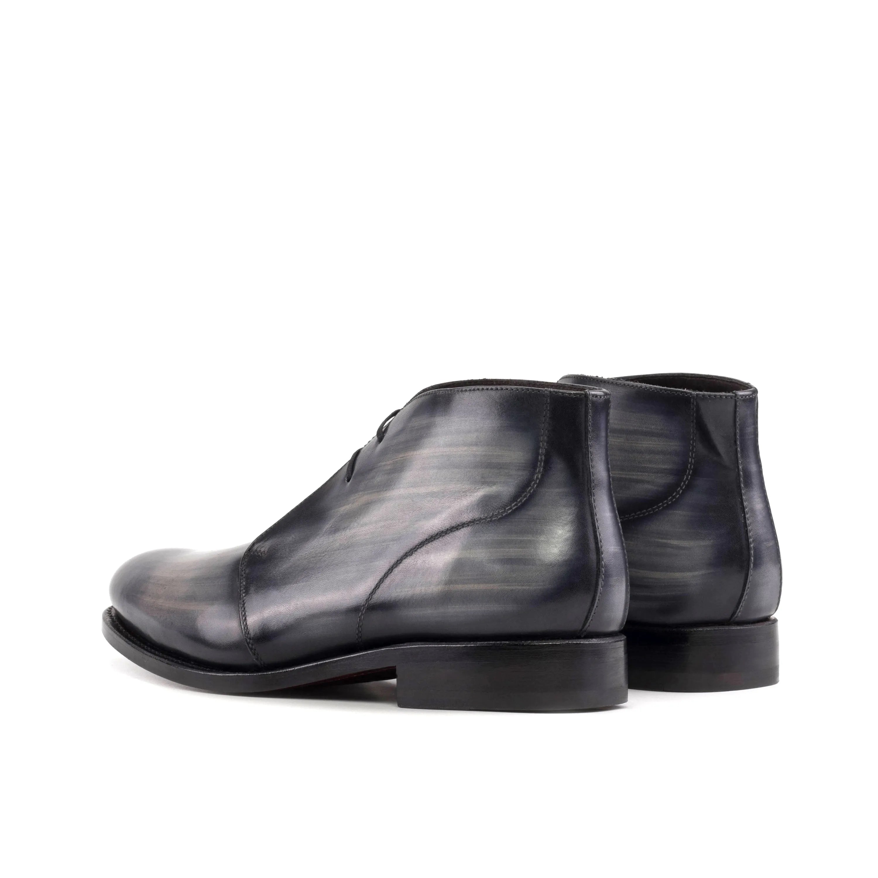 Gray leather Othello Patina Chukka boots showcasing elegant craftsmanship and style