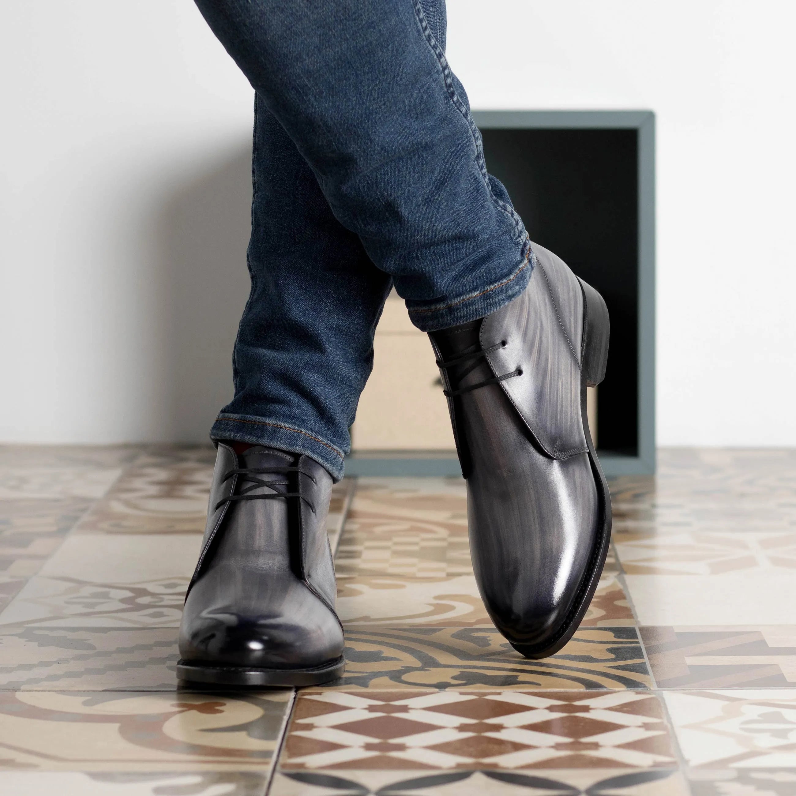 Gray leather Othello Patina Chukka boots featuring a stylish design and premium quality