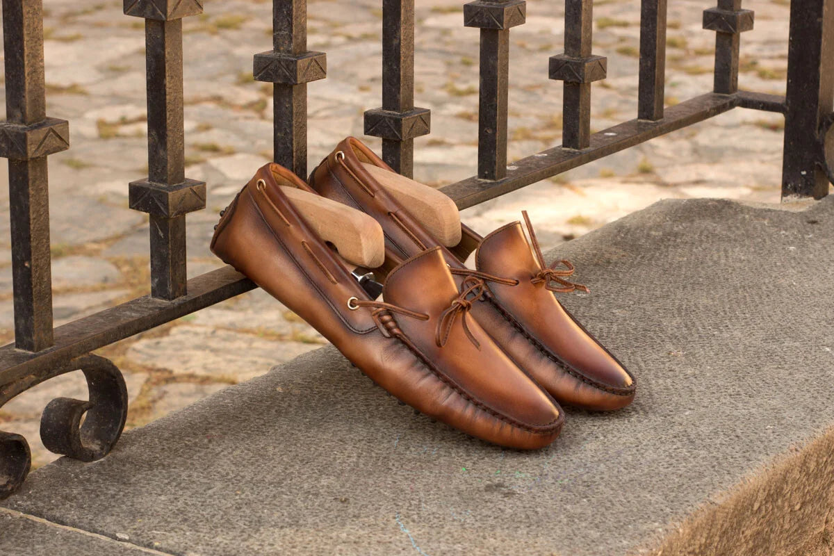 Pair of brown leather loafers featured in The NEW Driving Mocassin article.