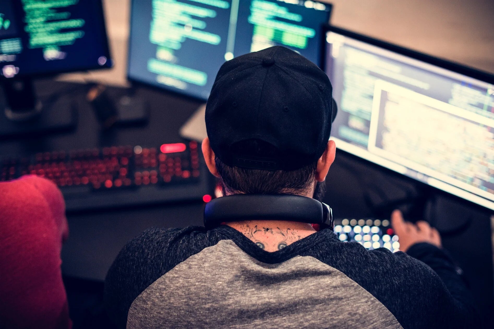 Person coding at a computer for a custom shoe lasts and made-to-measure roadmap project.