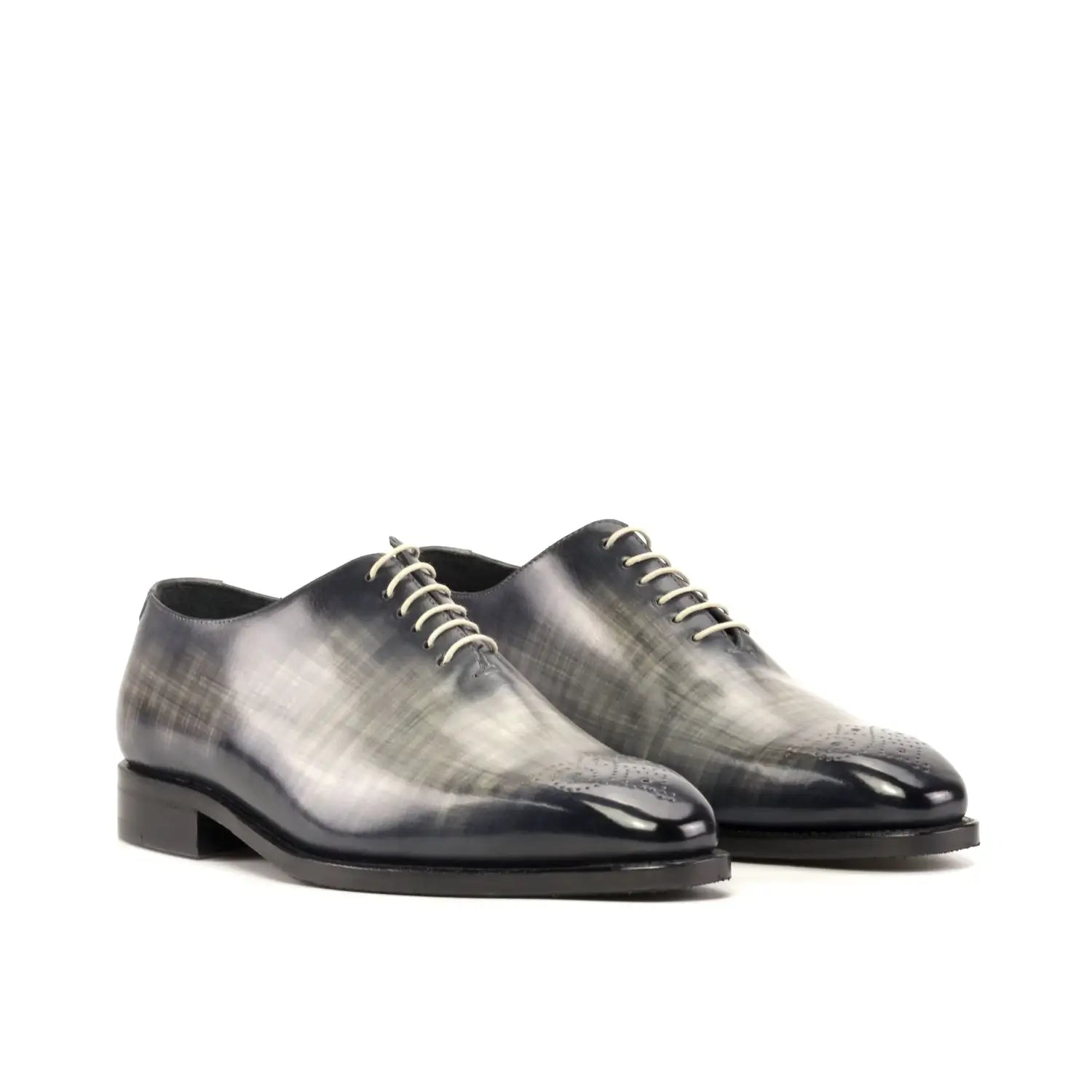 Polished black and gray oxford shoes with bespoke tailoring details