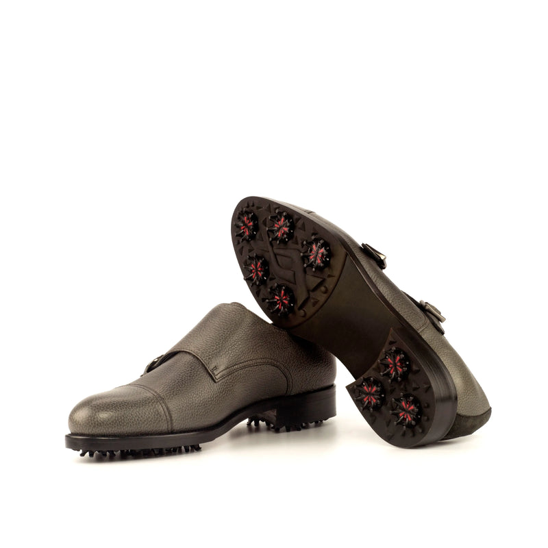 Gray leather Puck golf shoes designed for stylish performance on the course