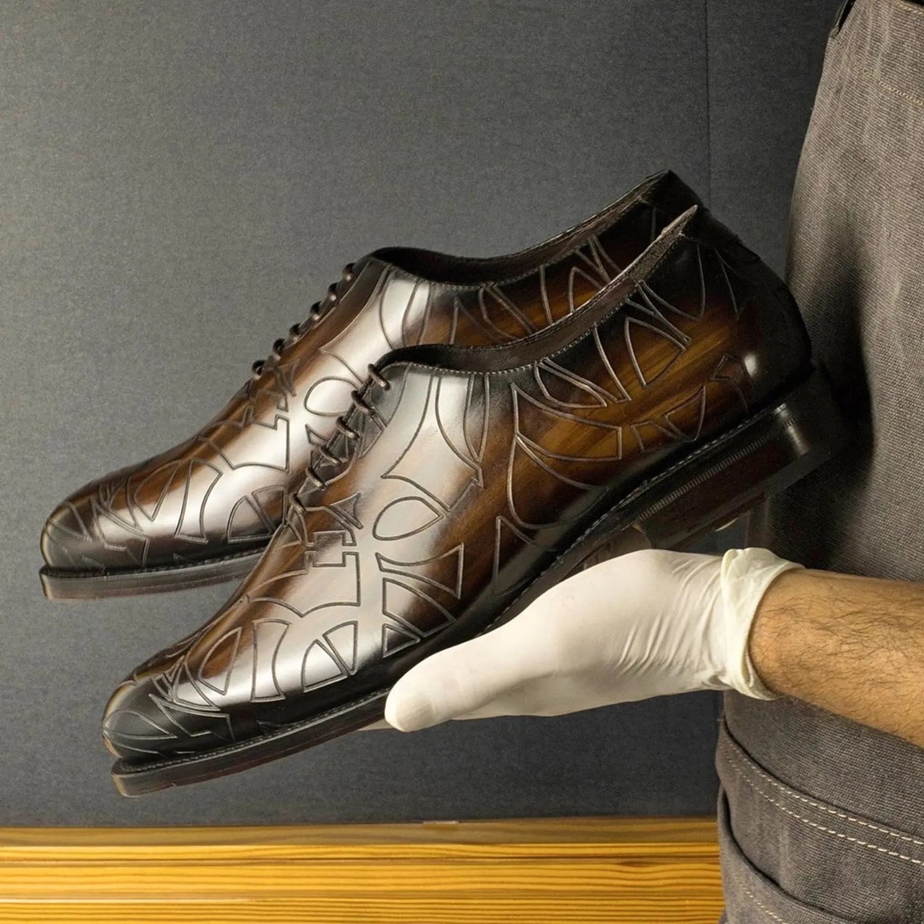 Patterned brown leather Quswa Patina Wholecut Shoes featuring a sleek fiddled waist design