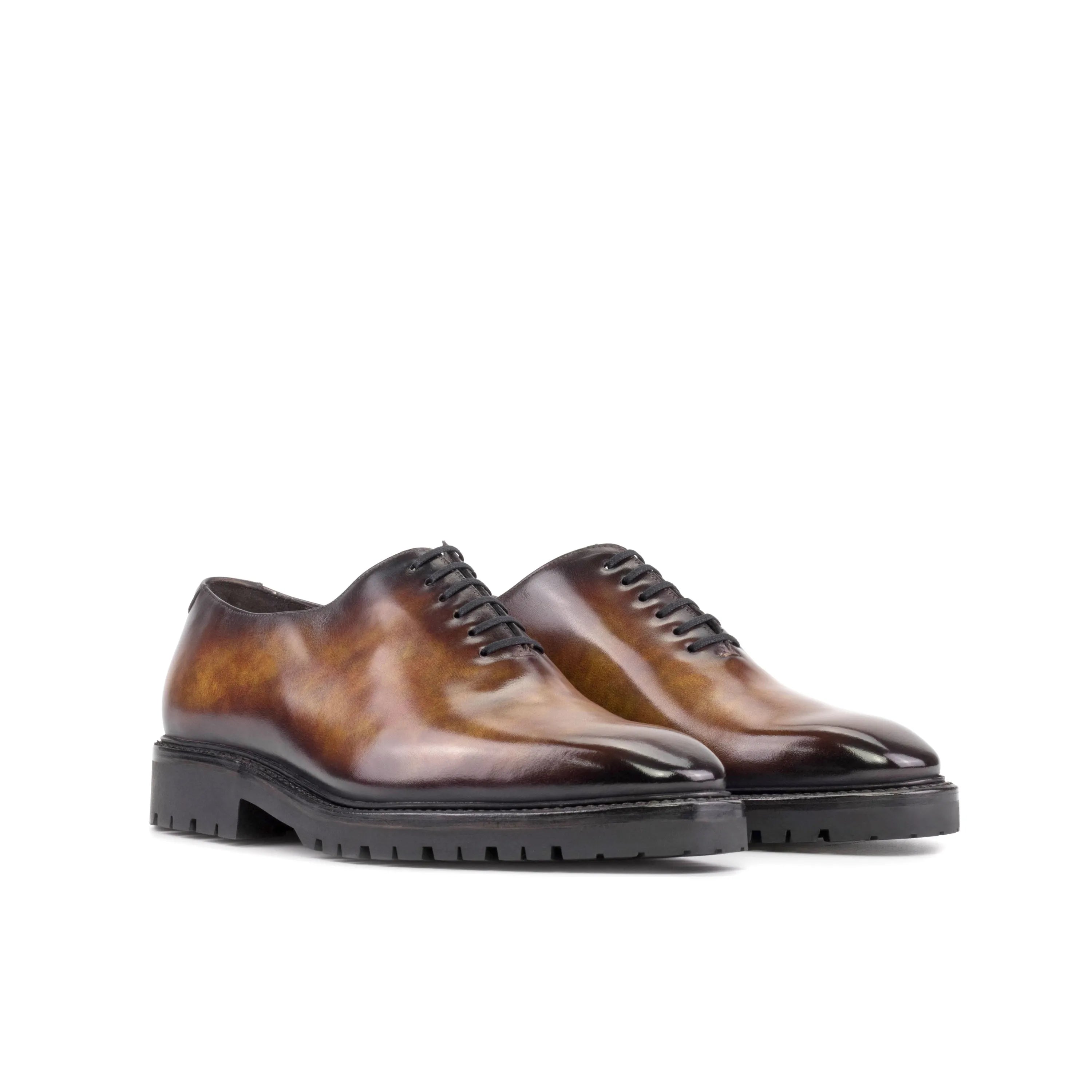 Brown leather Raigon Patina Wholecut shoes showcasing elegant craftsmanship