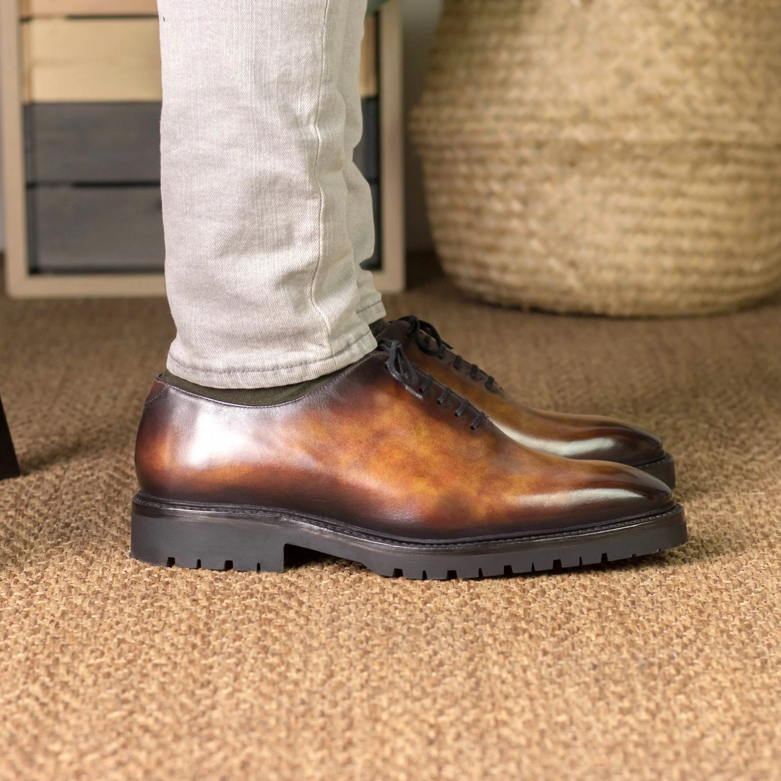 Brown leather Raigon Patina Wholecut shoes featuring durable lug soles for enhanced traction