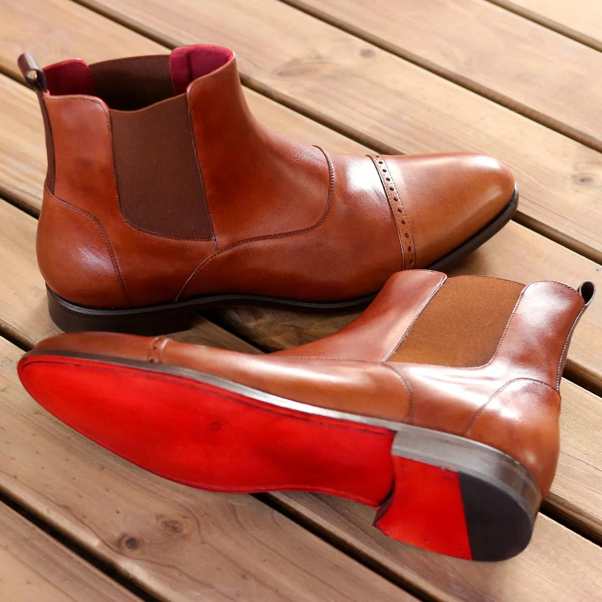 Pair of brown painted calf Rondos Chelsea Boots displayed elegantly
