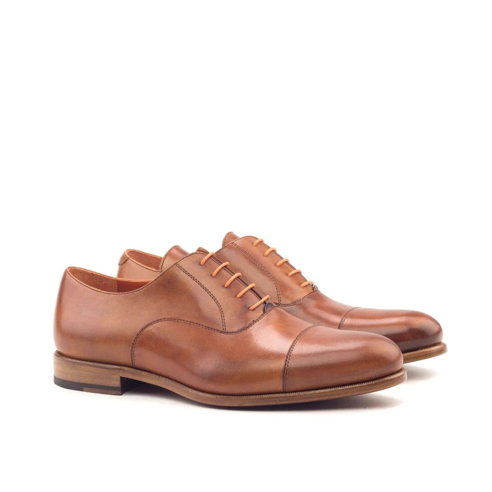 Pair of brown leather Saint Oxford Shoes, showcasing classic elegance in Oxford shoes