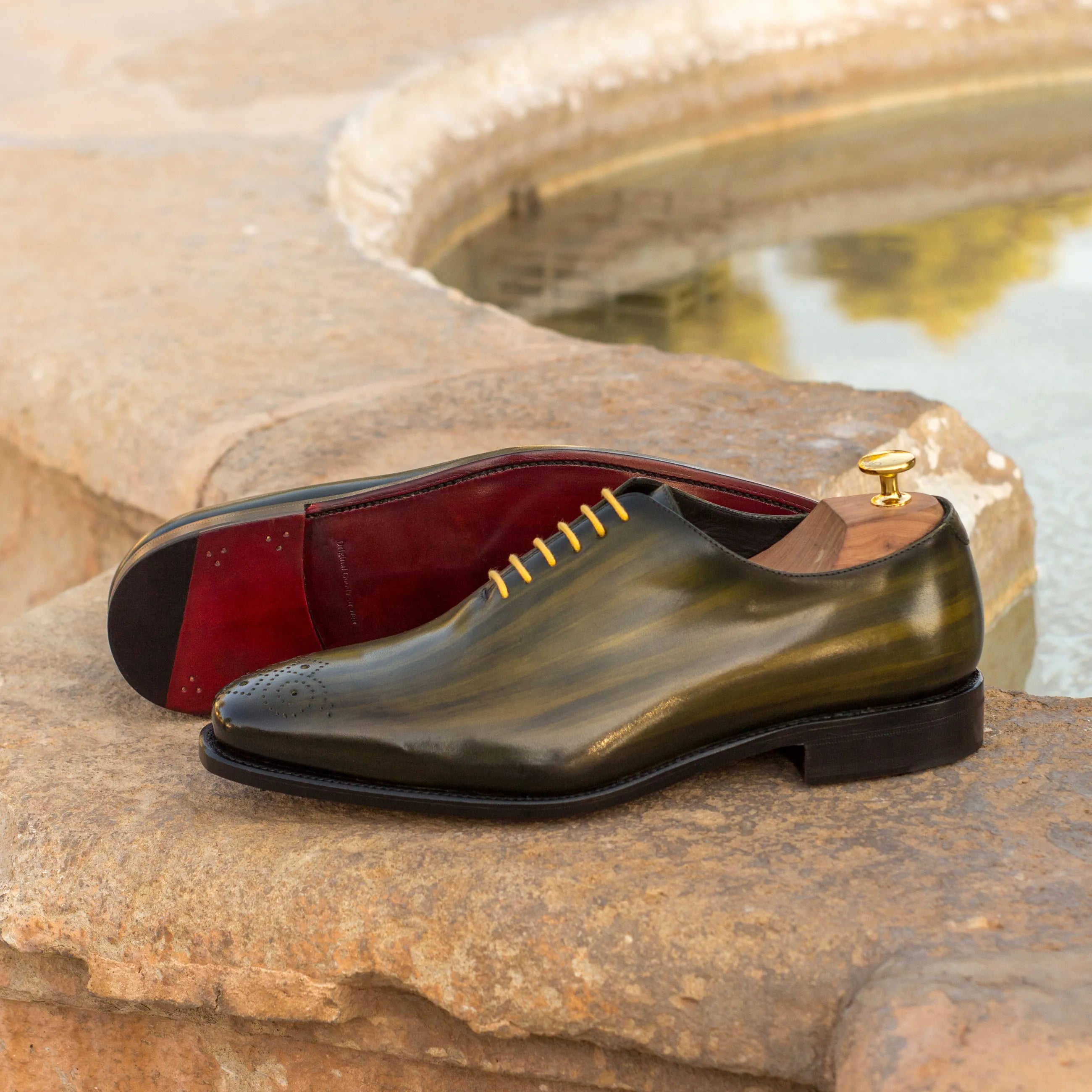 Olive green leather Serb Whole Cut Patina shoes, showcasing exquisite cut patina craftsmanship