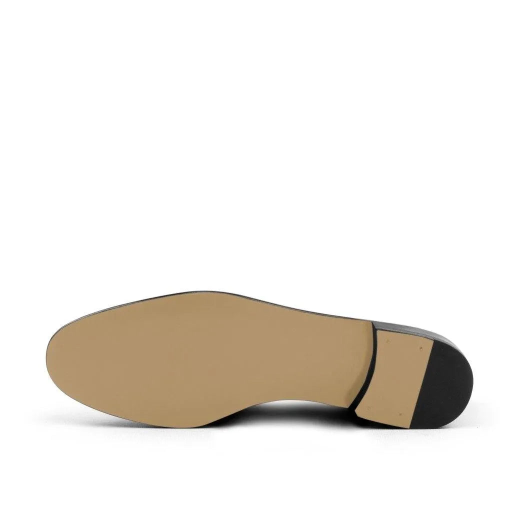 Tan leather shoe sole of the Sheikh Wellington Slipon, showcasing premium craftsmanship