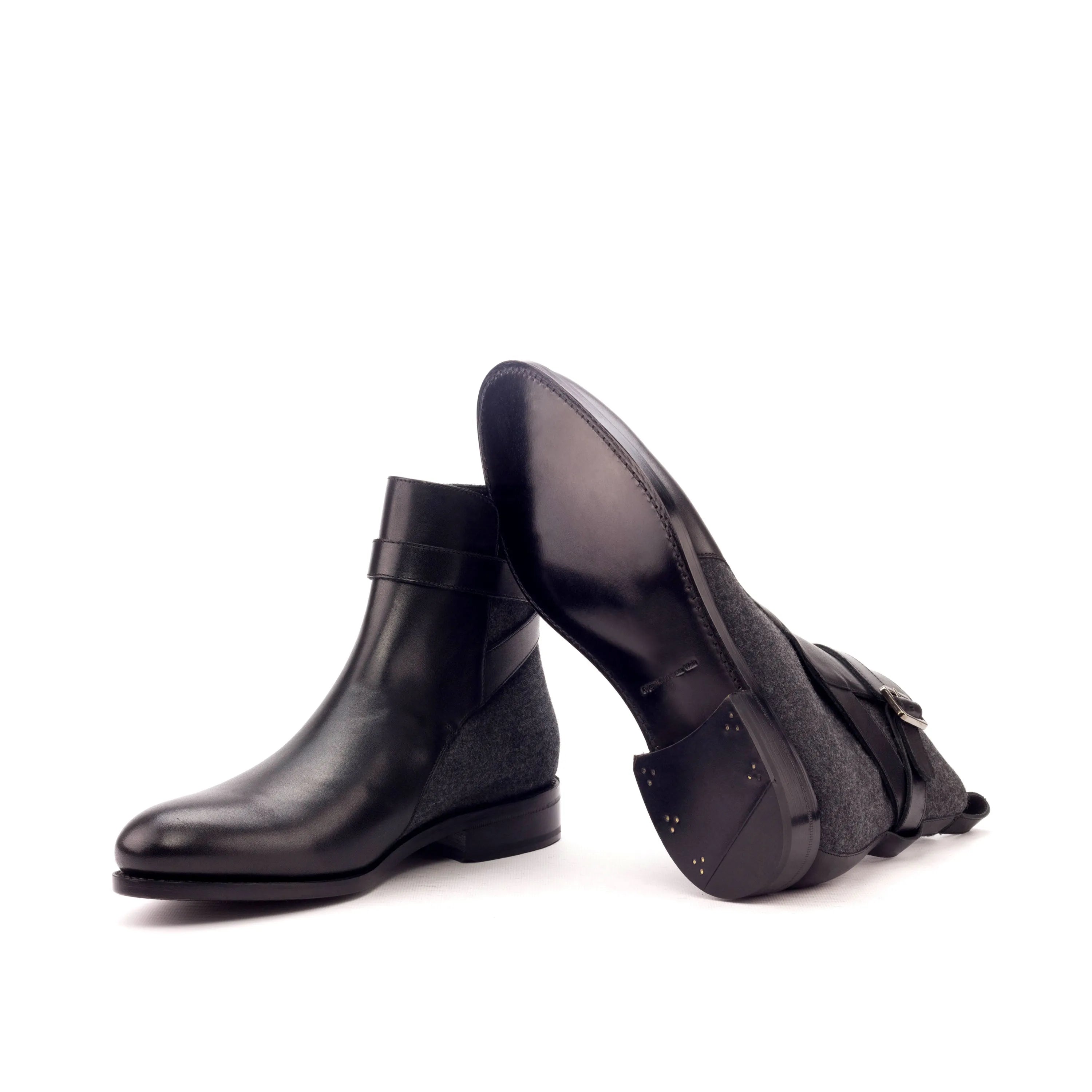 Black leather ankle boots styled as Singapor Jodhpur Boots for a sleek look