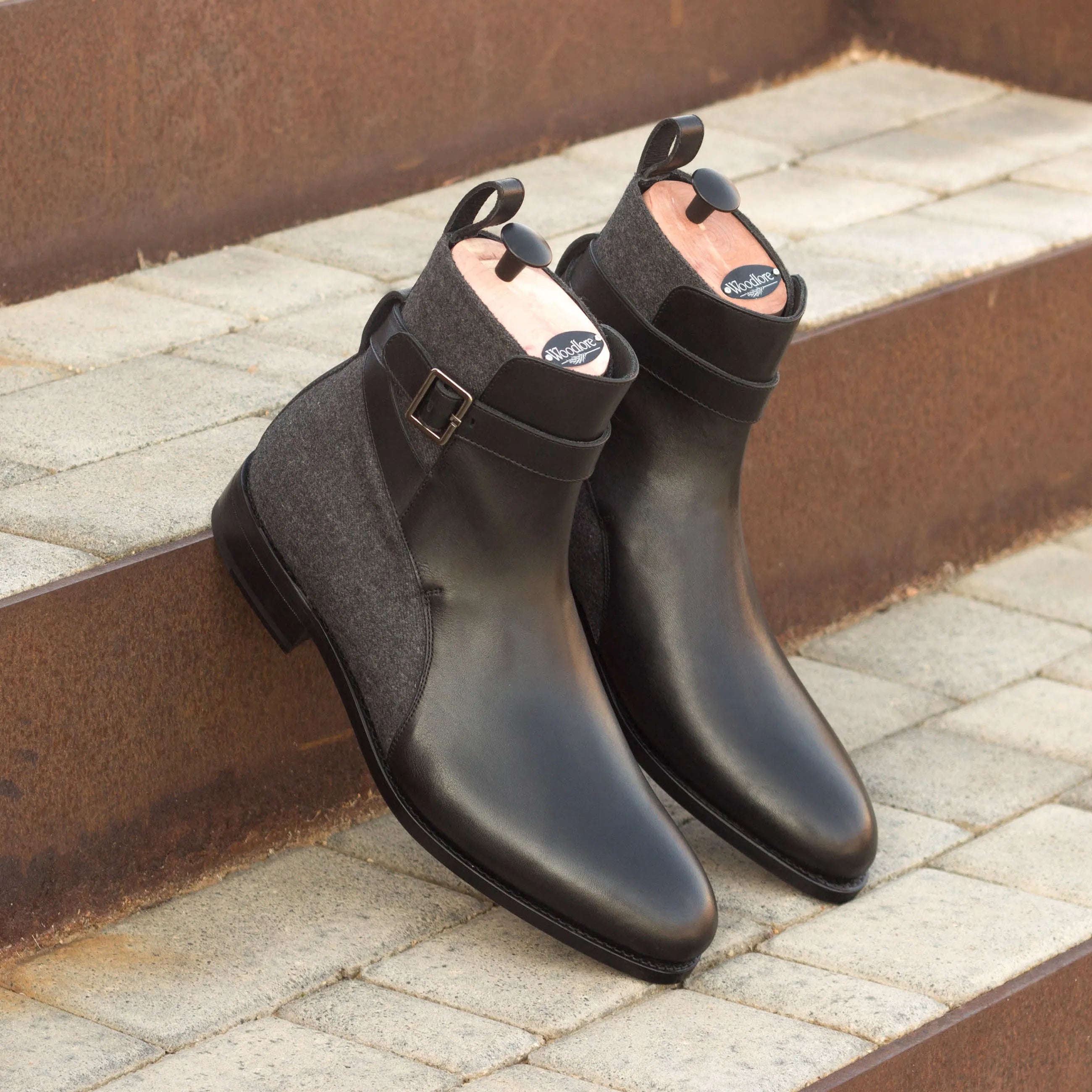 Pair of black leather and gray fabric Singapor Jodhpur Boots displayed elegantly