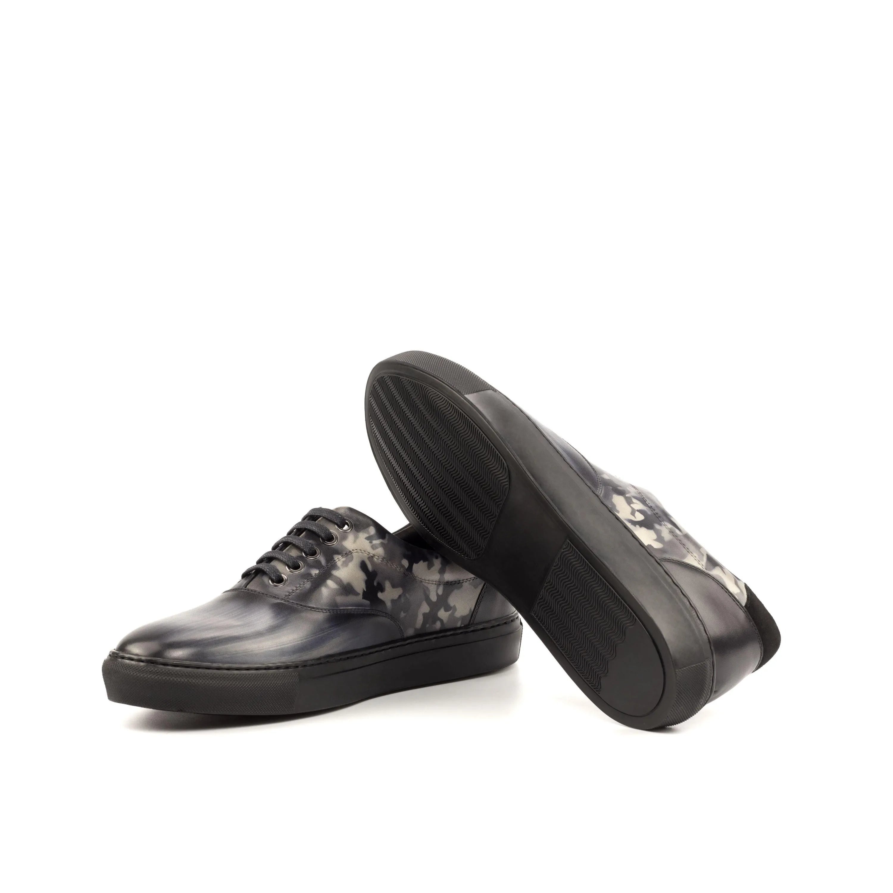 Pair of black and gray patterned Sita Top Sider Patina Sneakers for stylish comfort