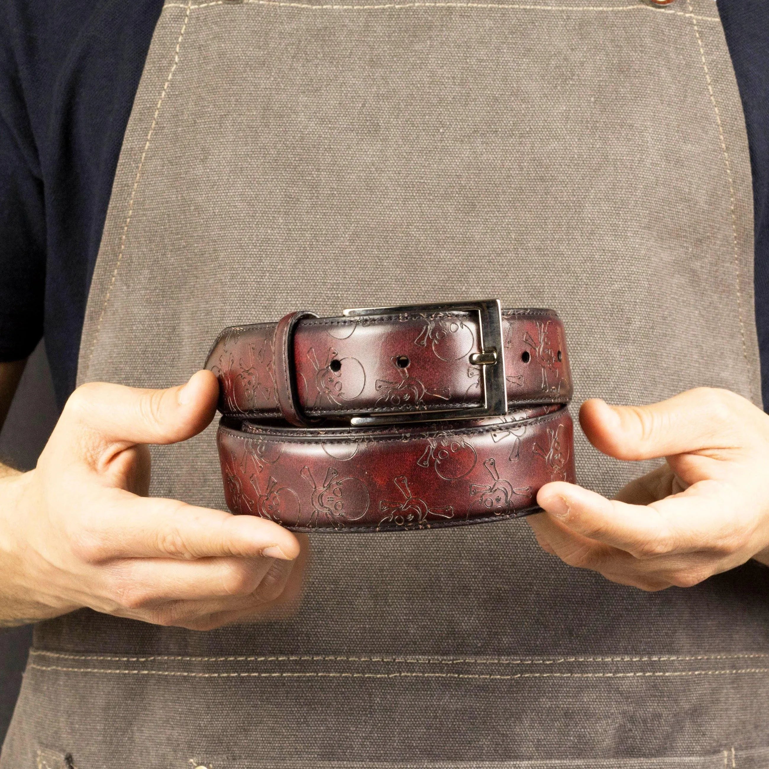 Burgundy leather Skull Patina Hamptons Belt featuring a striking skull pattern design