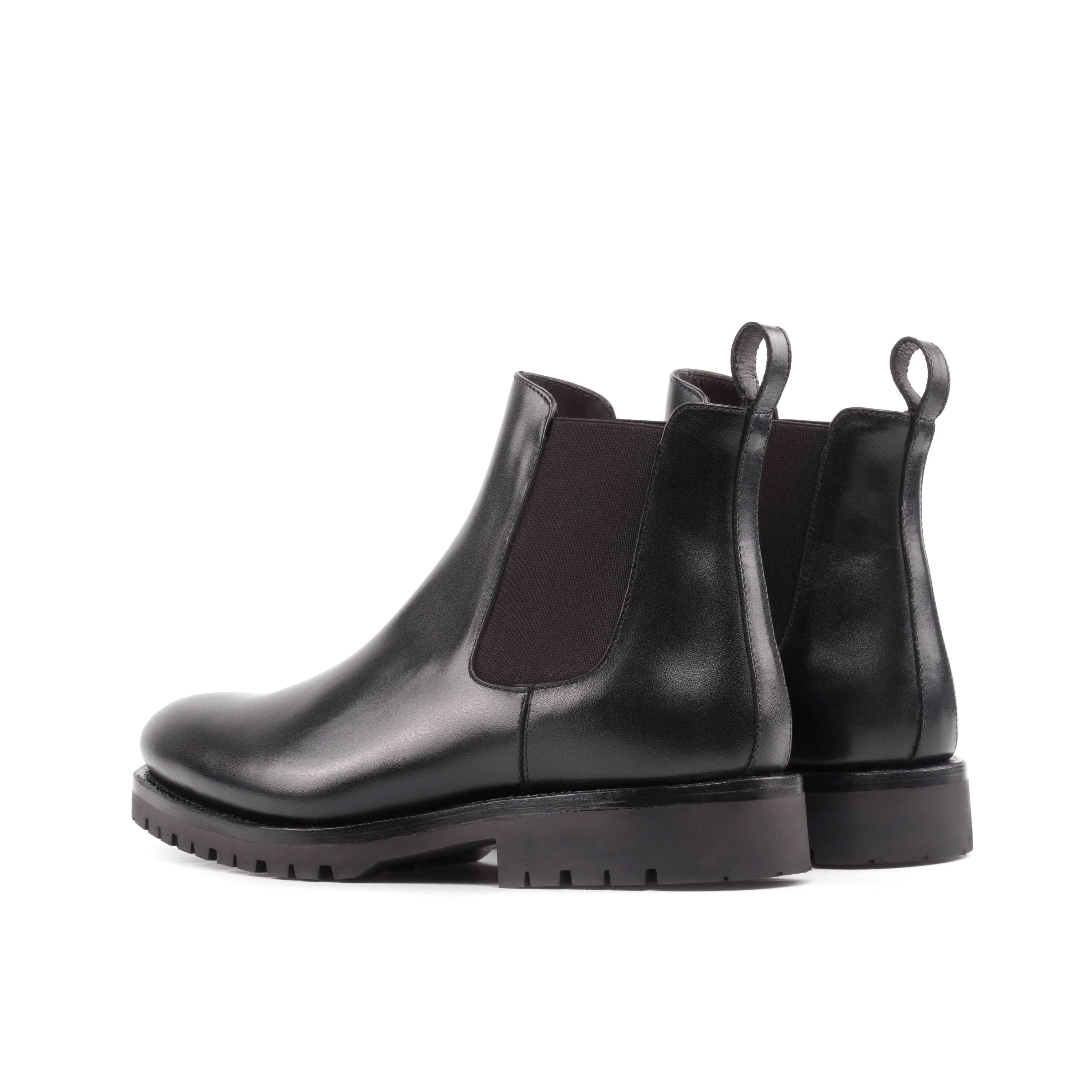 Black leather Solitude Chelsea Boots elegantly displayed for versatile styling options