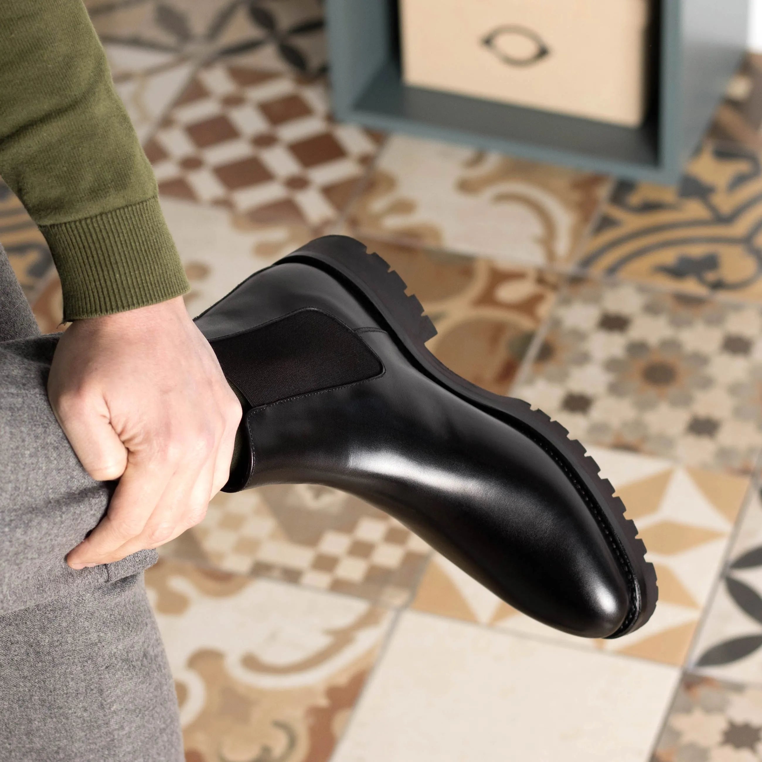 Black leather Solitude Chelsea Boots showcasing elegant design and superior comfort