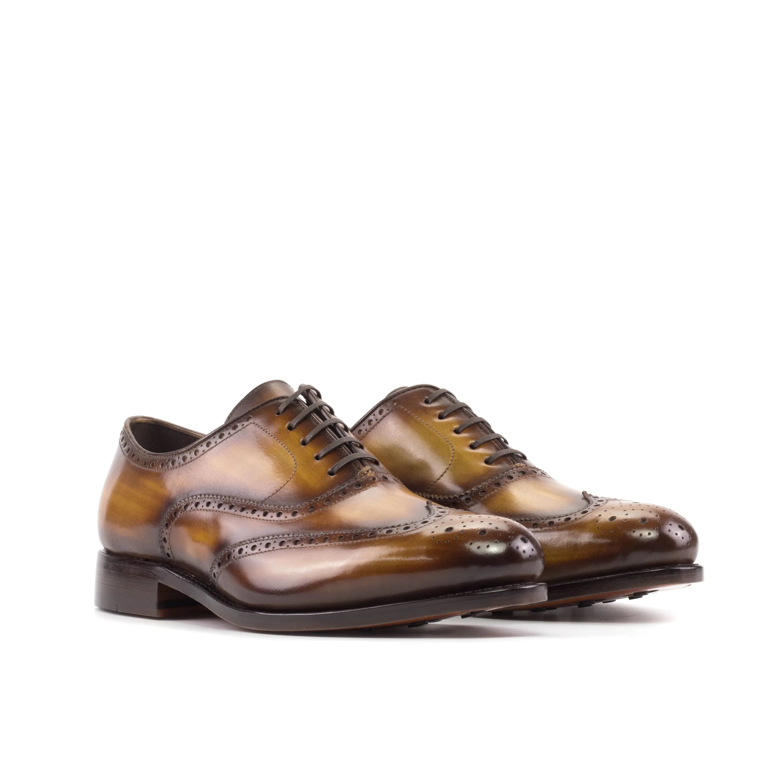 Brown leather wingtip dress shoes, showcasing Spectral Patina full brogue design