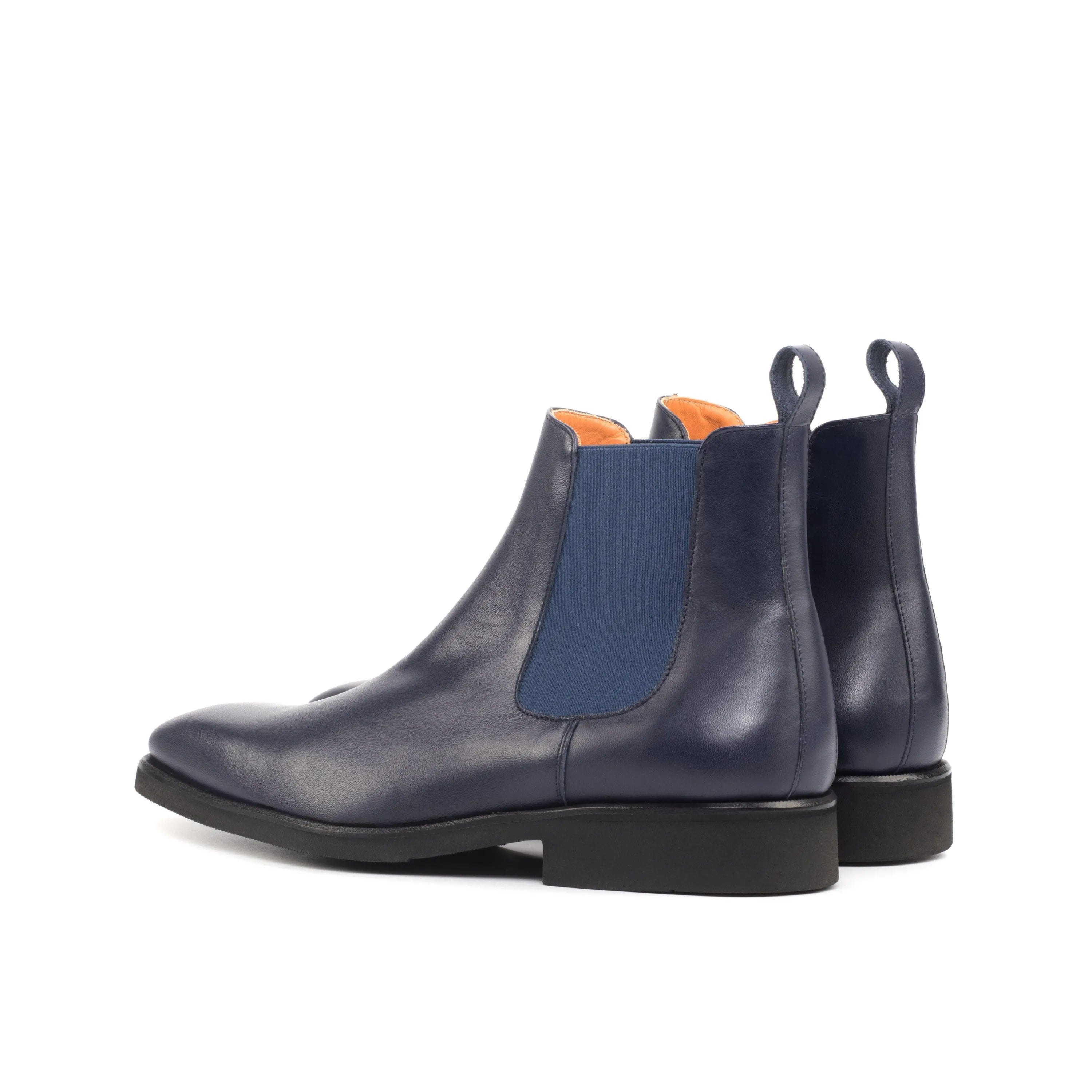 Pair of blue leather Stephano Chelsea Boots displayed elegantly on a neutral background