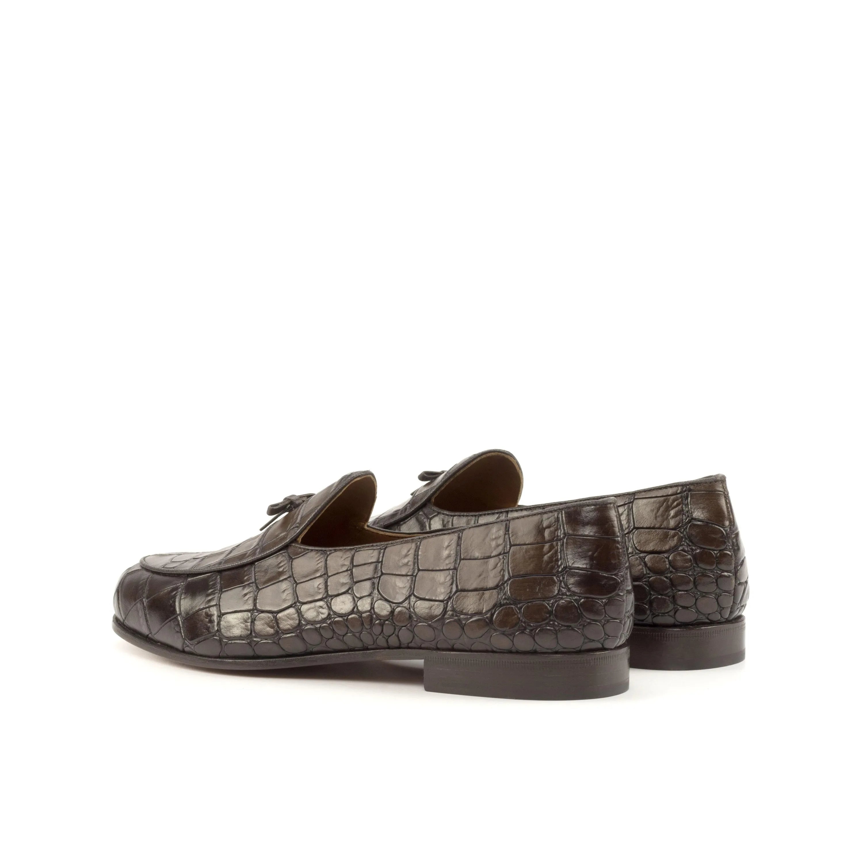 Pair of brown crocodile loafers featured in St. John’s Belgian Slipper collection