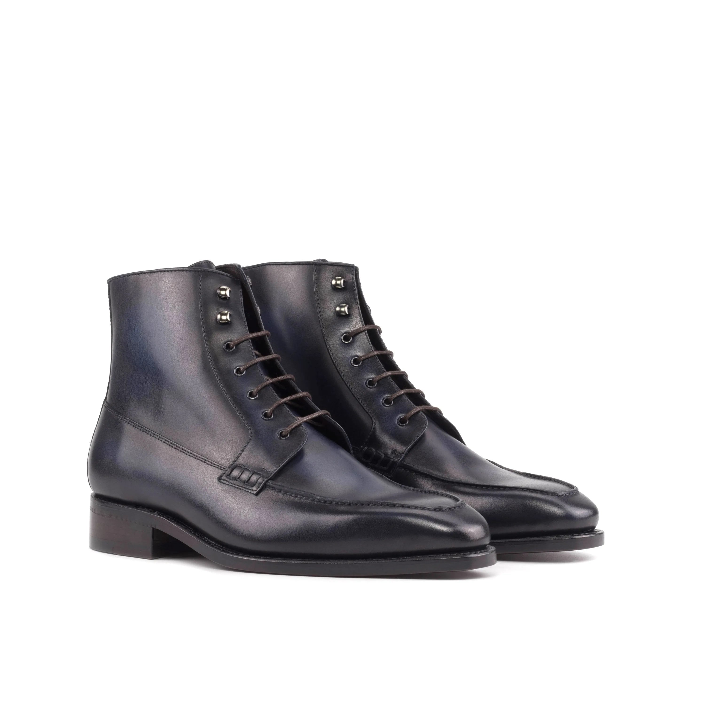 Pair of black leather lace-up Summit Moc Boots showcasing stylish and durable design