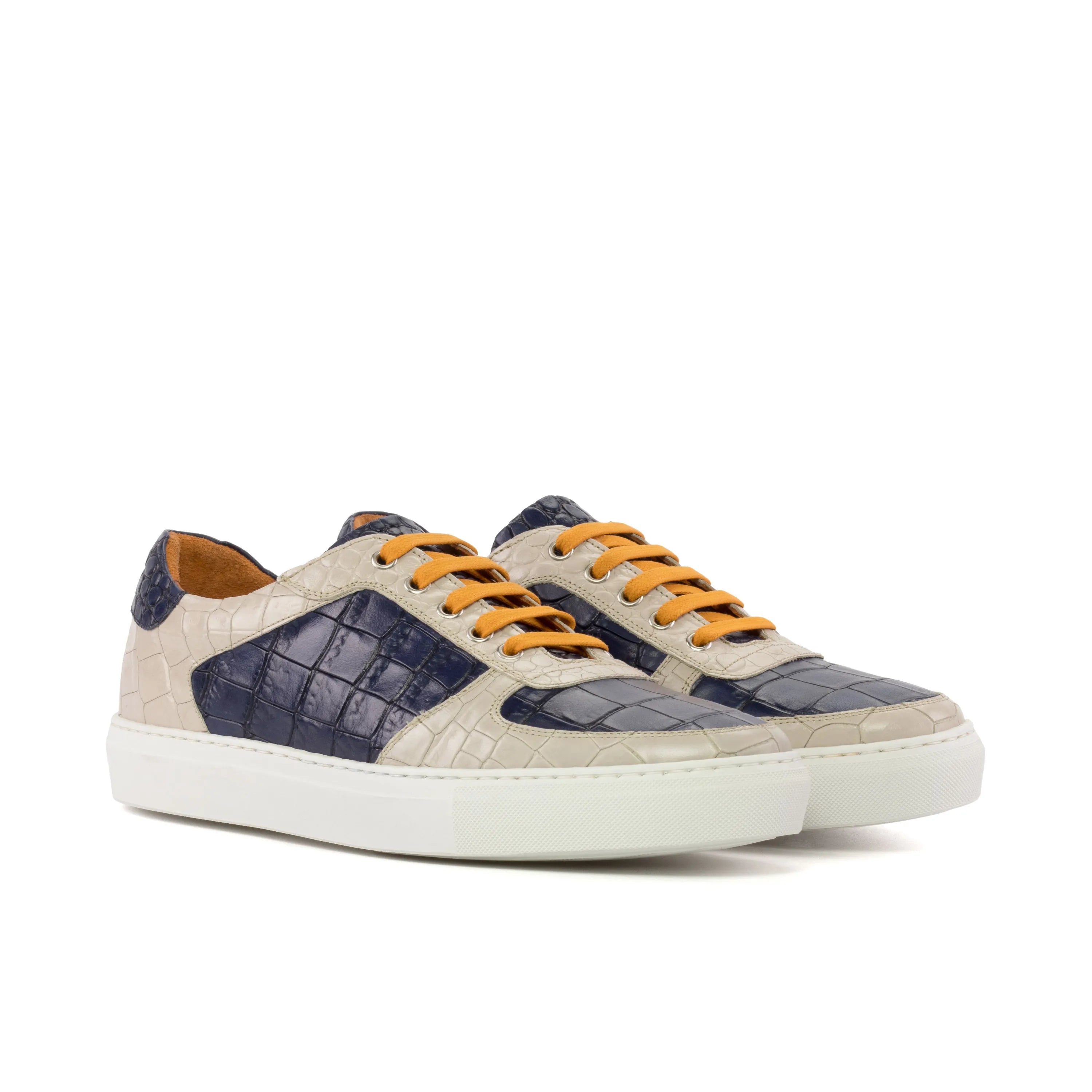 Two Sunda Low Top Sneakers featuring a stylish crocodile pattern in painted croco design