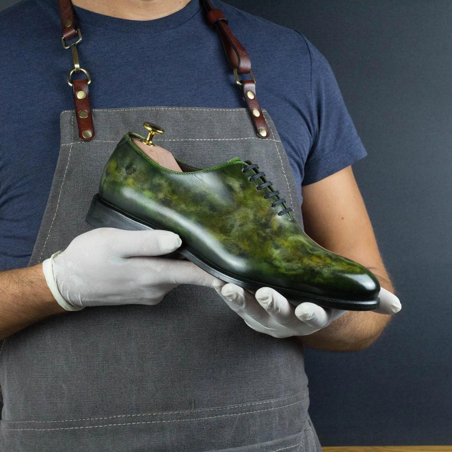 Green leather Sylvan Patina Wholecut shoes showcasing exquisite craftsmanship and style