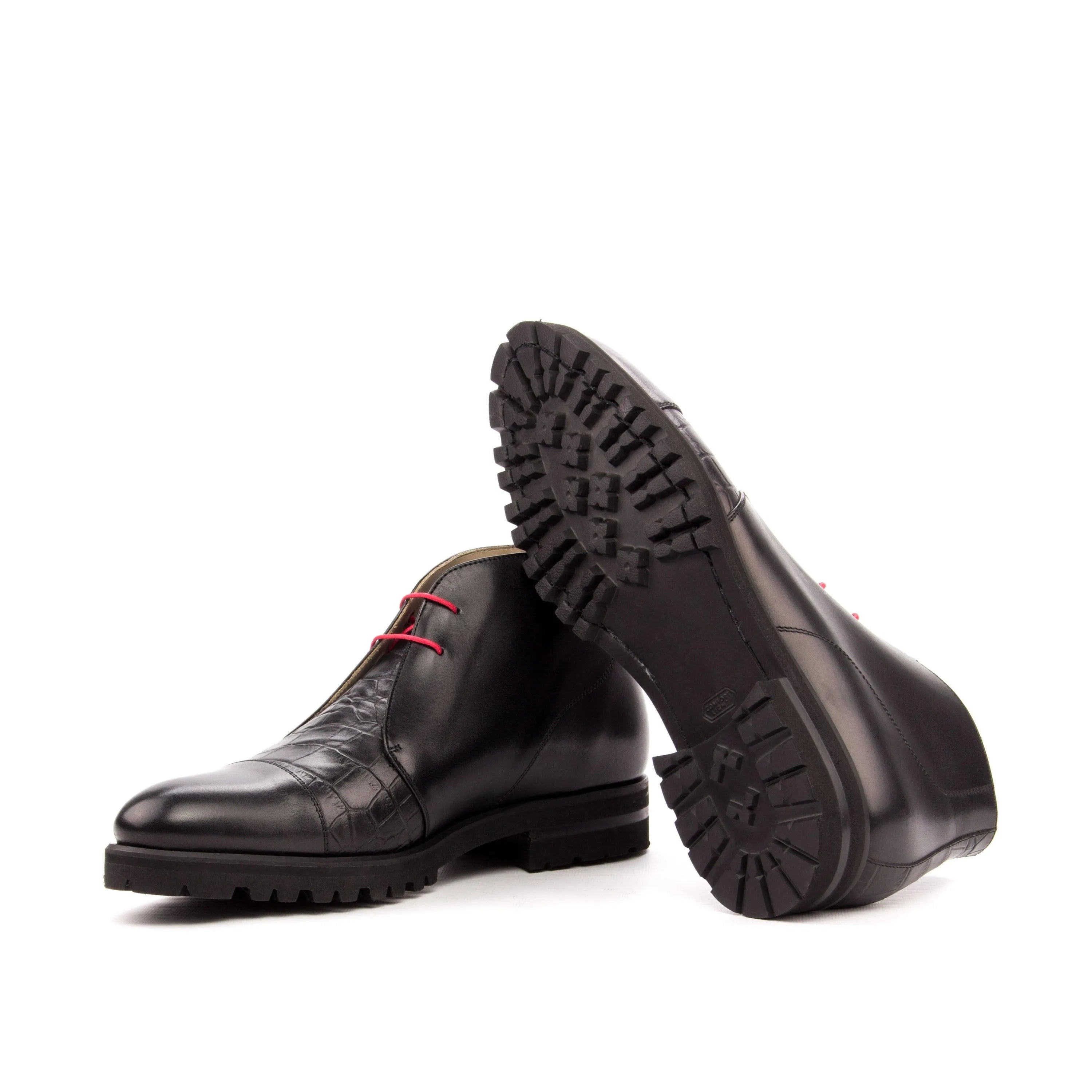 Pair of Tennes Chukkas II black leather boots with red laces for luxury men’s footwear