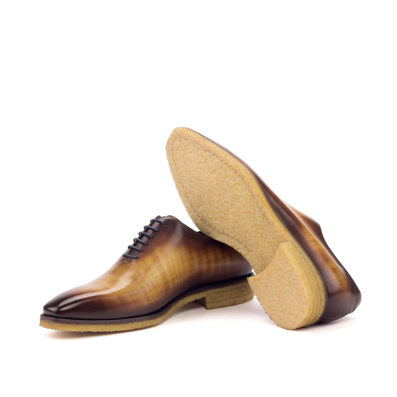 Brown leather dress shoes from Tesla Wholecut Patina II, showcasing elegant craftsmanship