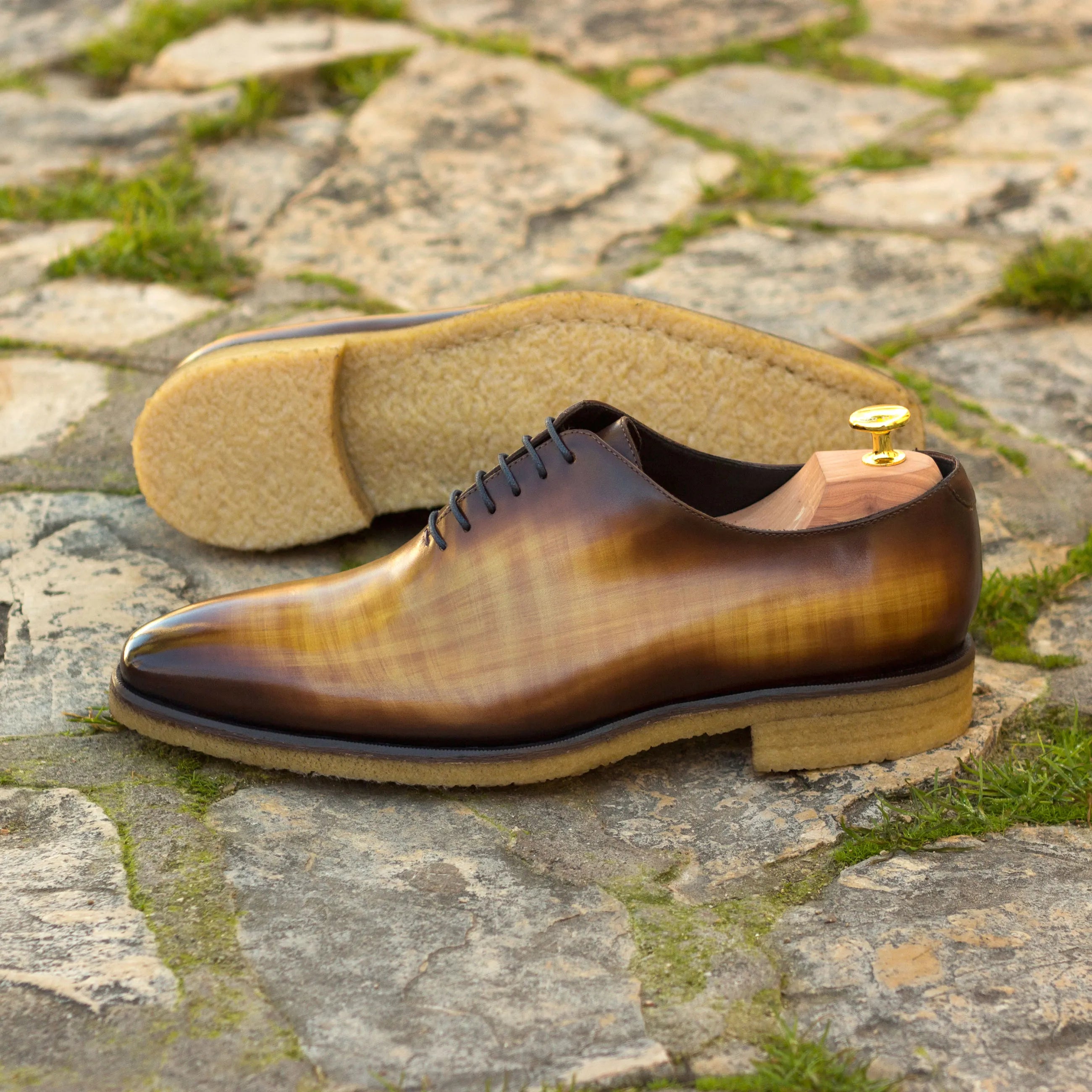 Brown leather dress shoe, Tesla Wholecut Patina, showcasing elegance and fine craftsmanship