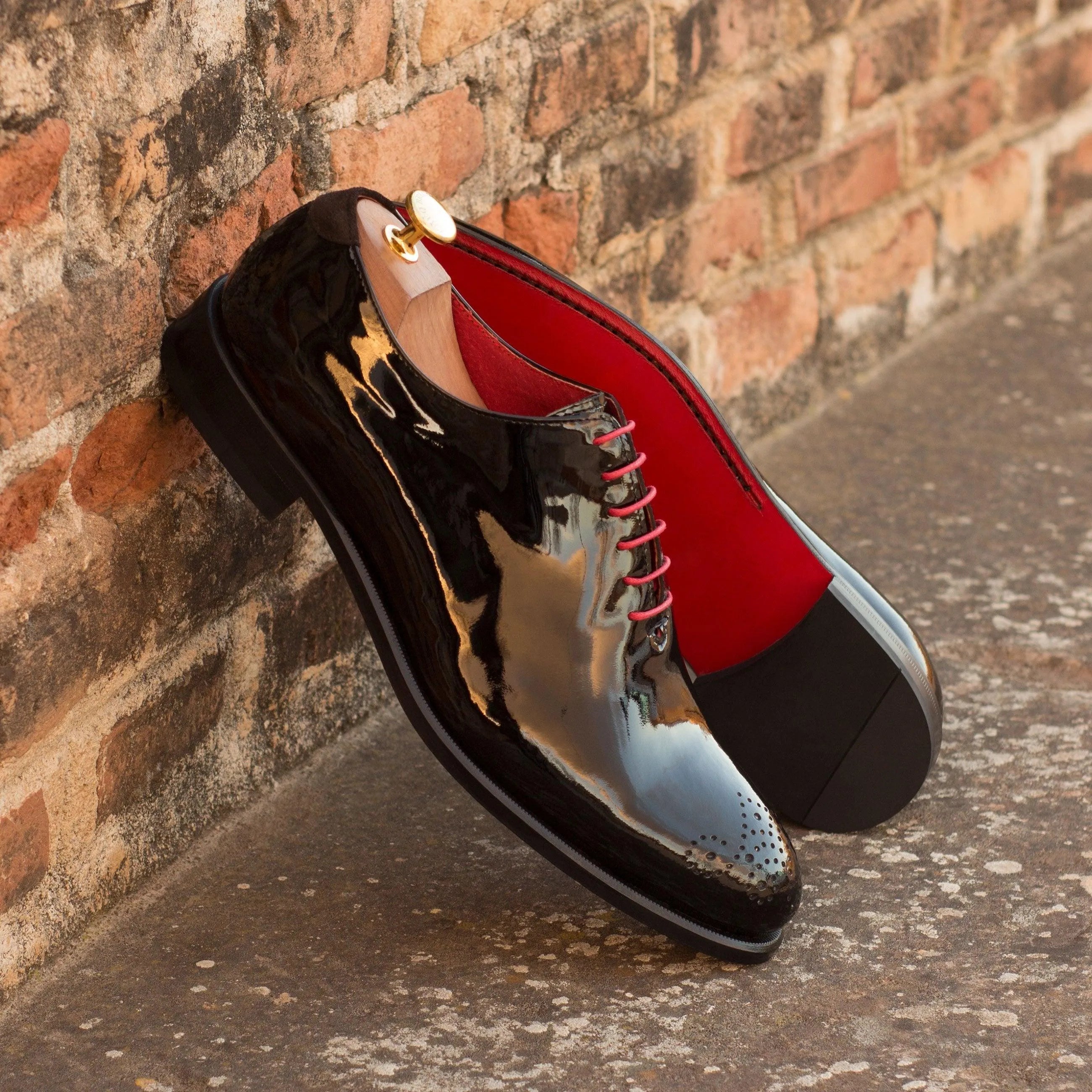 Shiny black Tetawkin Whole Cut Shoes II with red laces and rounded toe, luxury bespoke shoes for men