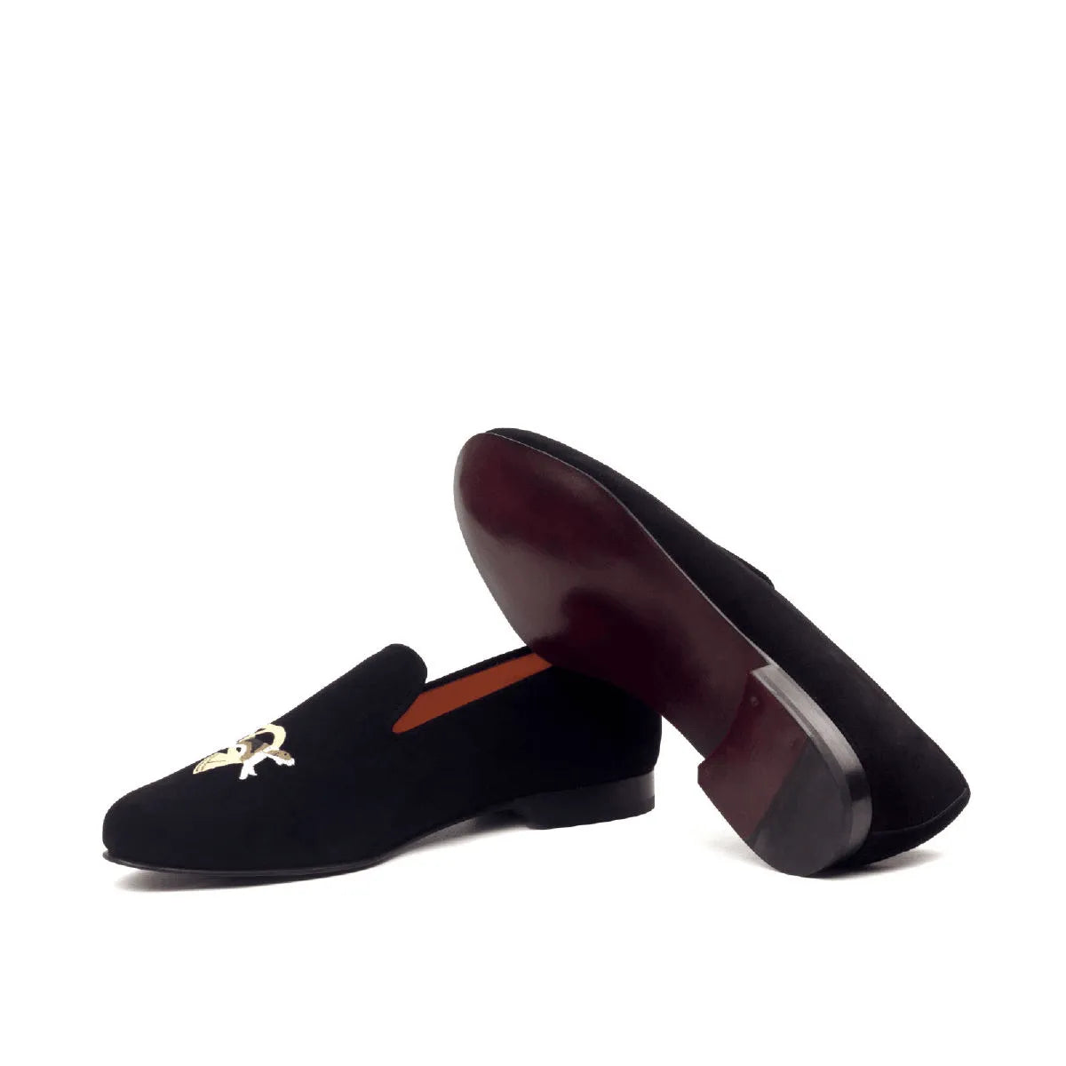 Black velvet loafers with gold embroidery from the Eye Wellington slip collection