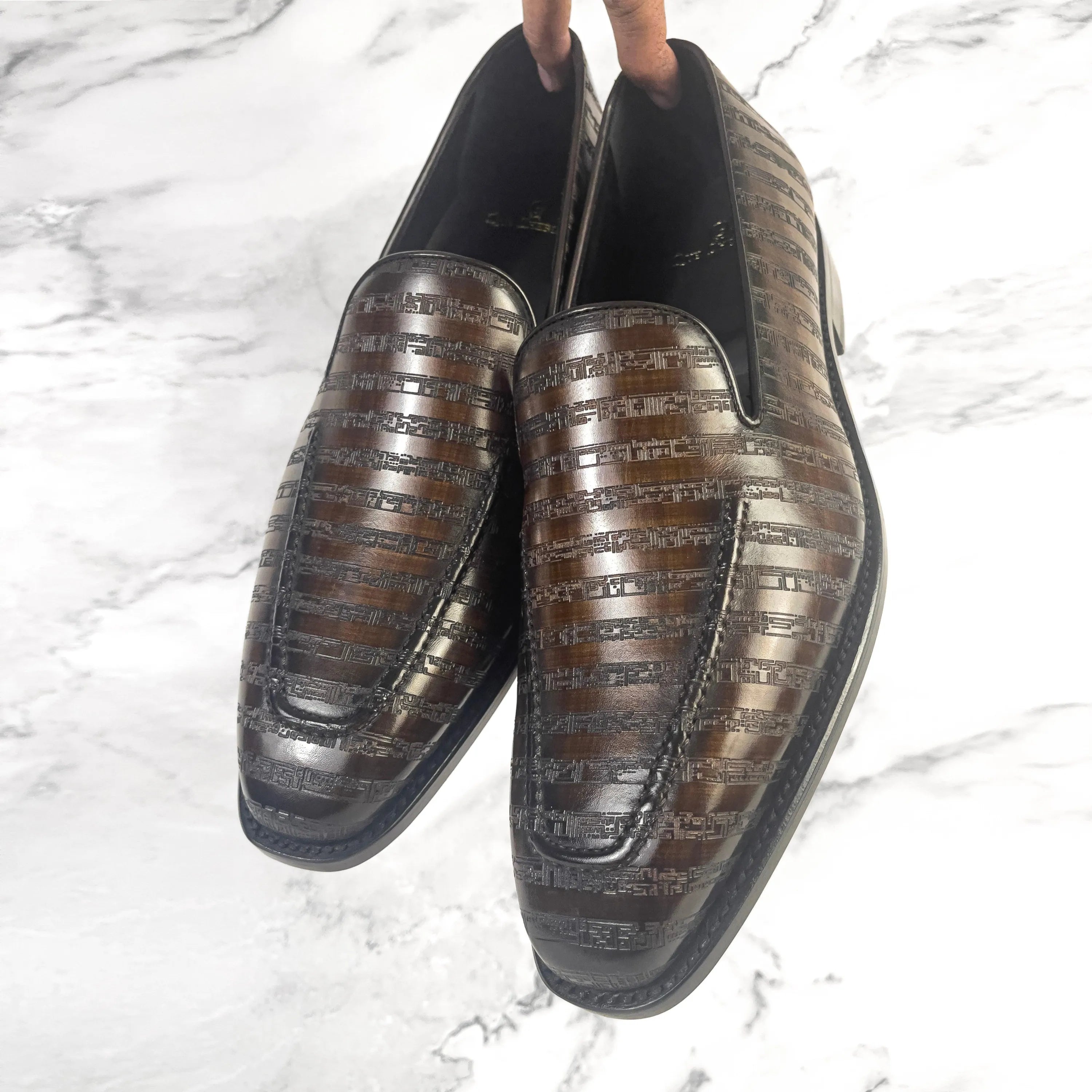 Pair of brown leather loafers, The Poet VIII Patina, featuring a leather art sole