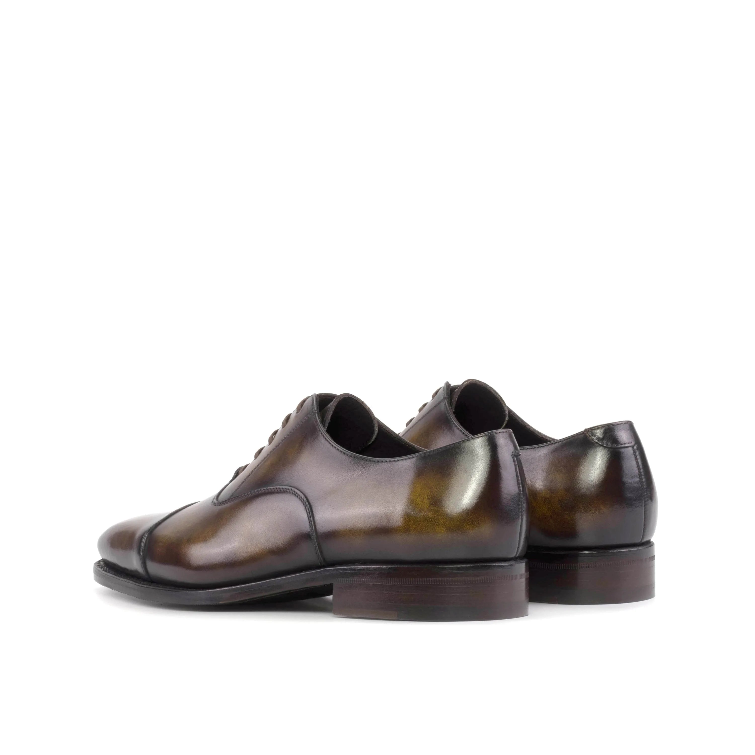 Pair of brown leather Thundro Patina Oxford shoes displayed in the Fast Lane collection