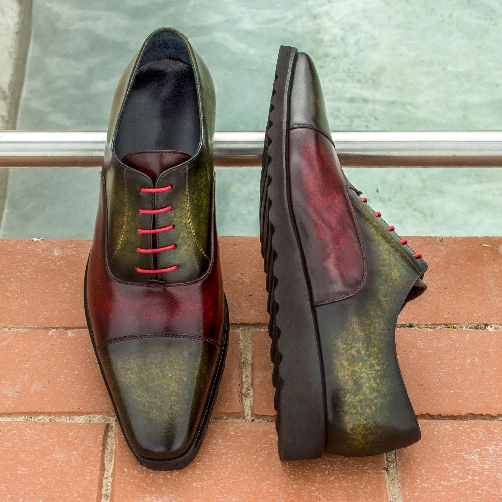 Two-toned Tice Oxford Patina shoes with red laces showcasing crust patina design