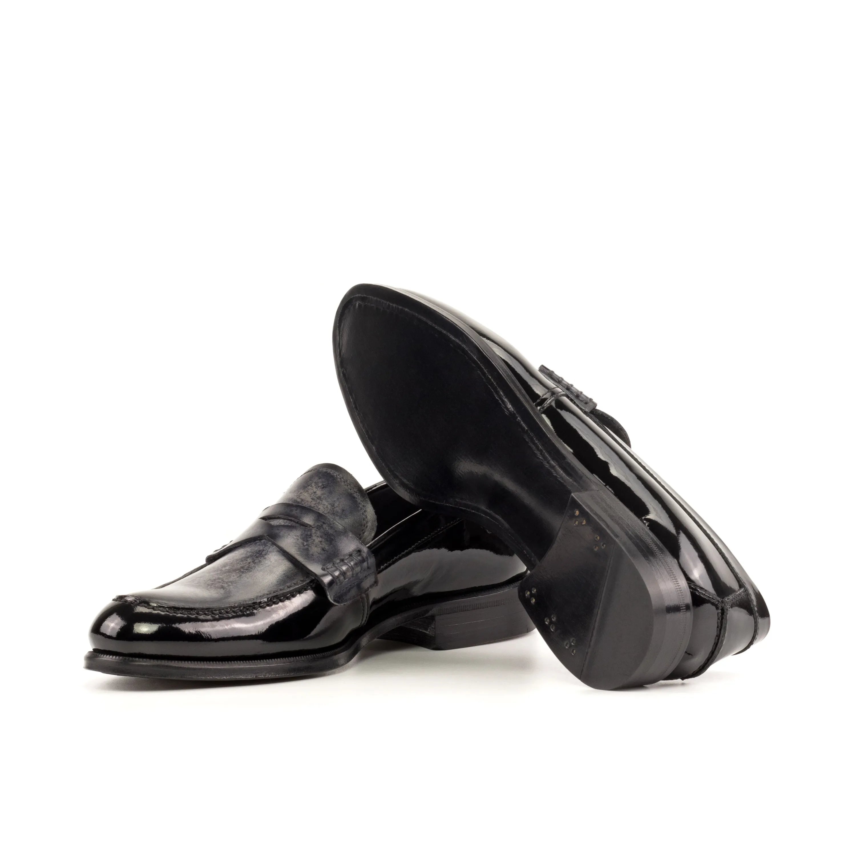 Pair of shiny black Titani Unisex Patina Loafers for a sleek and stylish look