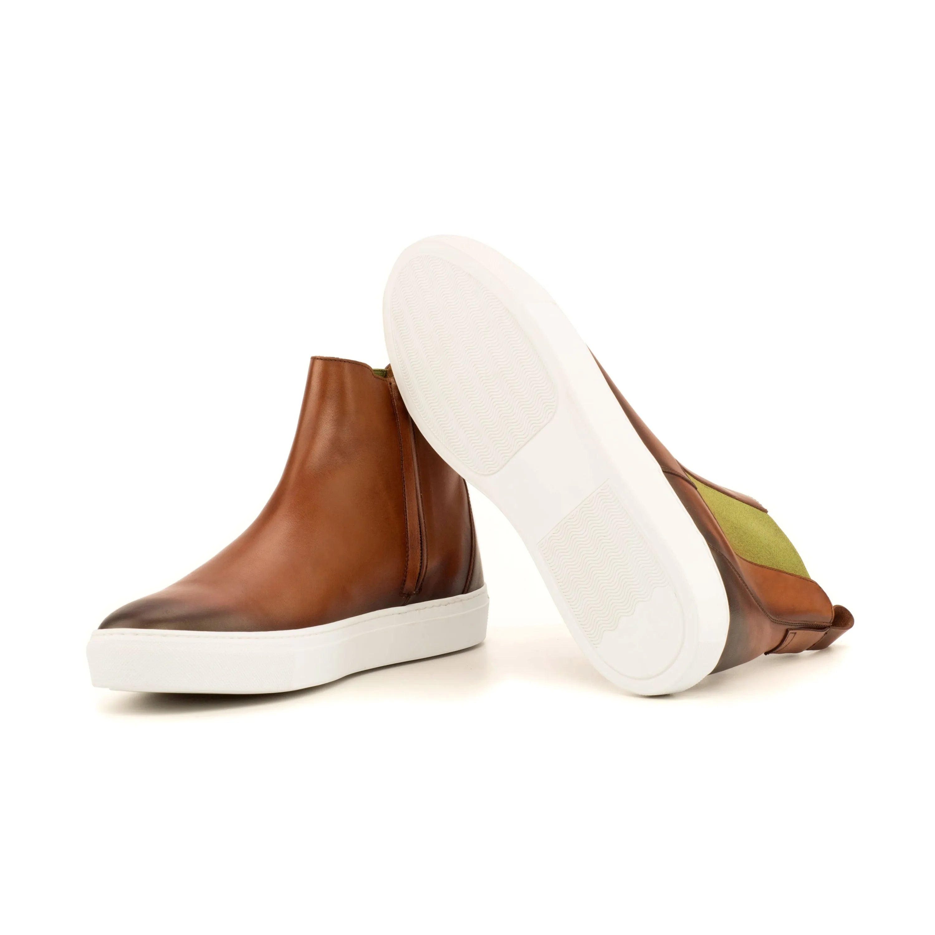 Brown leather TR99 Chelsea sneaker boots featuring stylish white soles