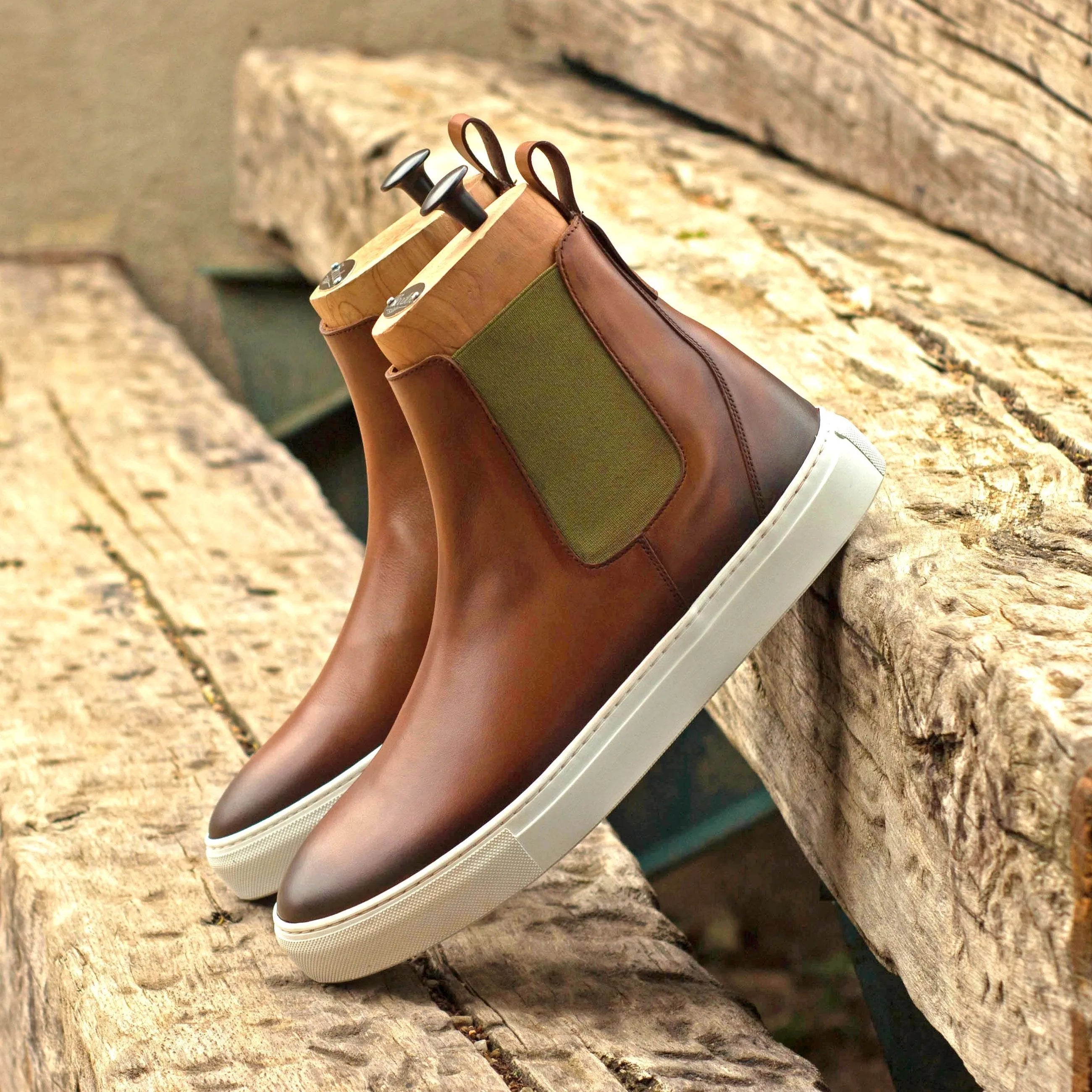 Brown leather TR99 Chelsea sneaker boots featuring stylish white soles for versatile wear