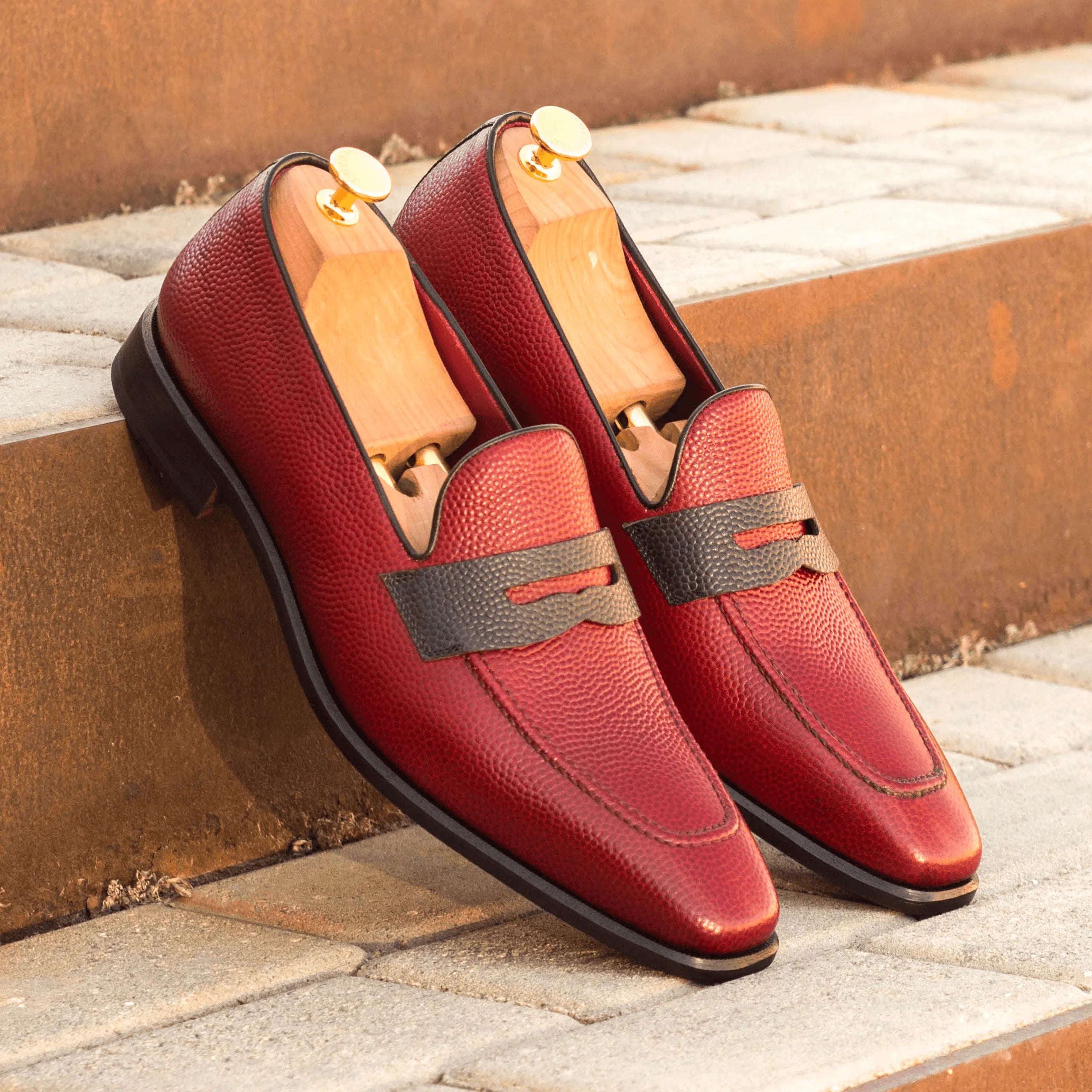 Pair of Tzu Loafers II in red leather, crafted from luxury pebble grain for men