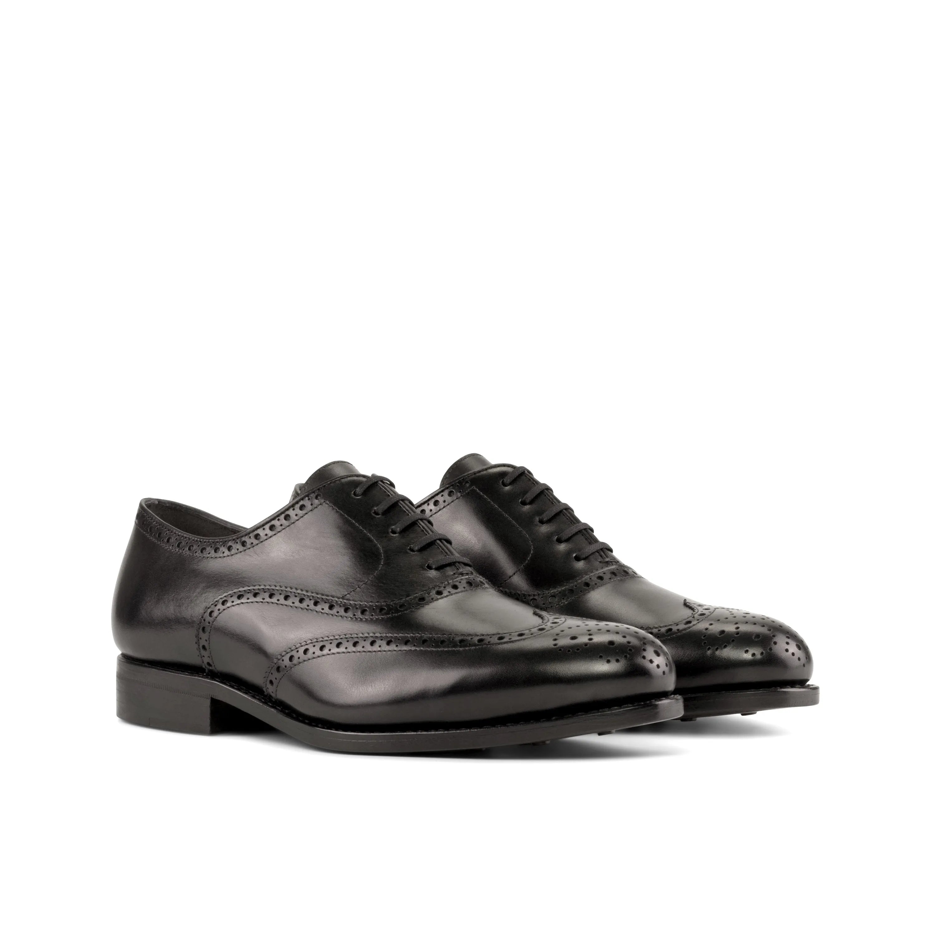 Pair of Umberto full brogue shoes in black leather, perfect dress shoes for the fast lane