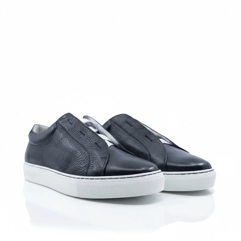 Black Italian leather laceless sneaker with white soles and textured upper