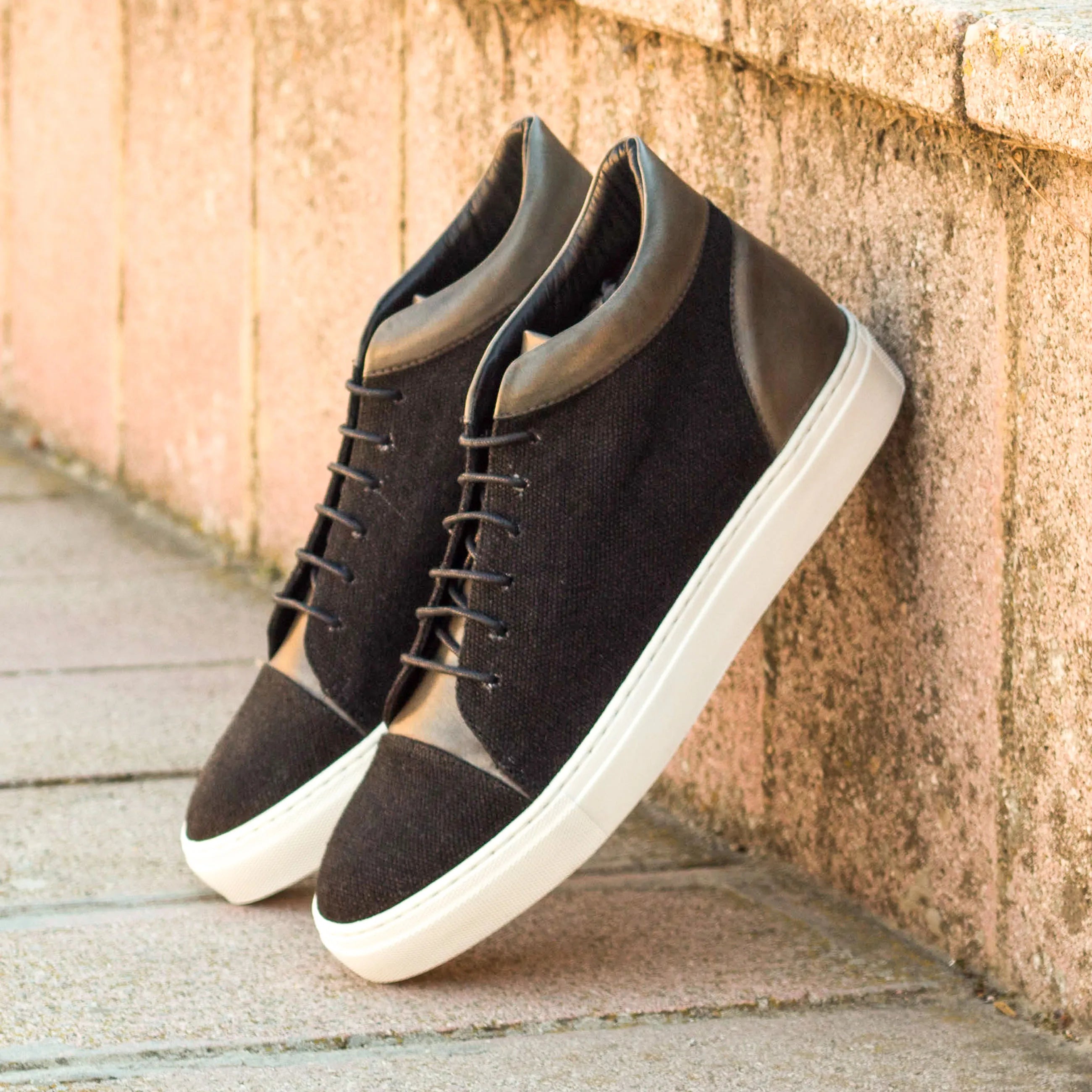 Black and brown Vega high top sneakers, a stylish choice in luxury bespoke shoes for men