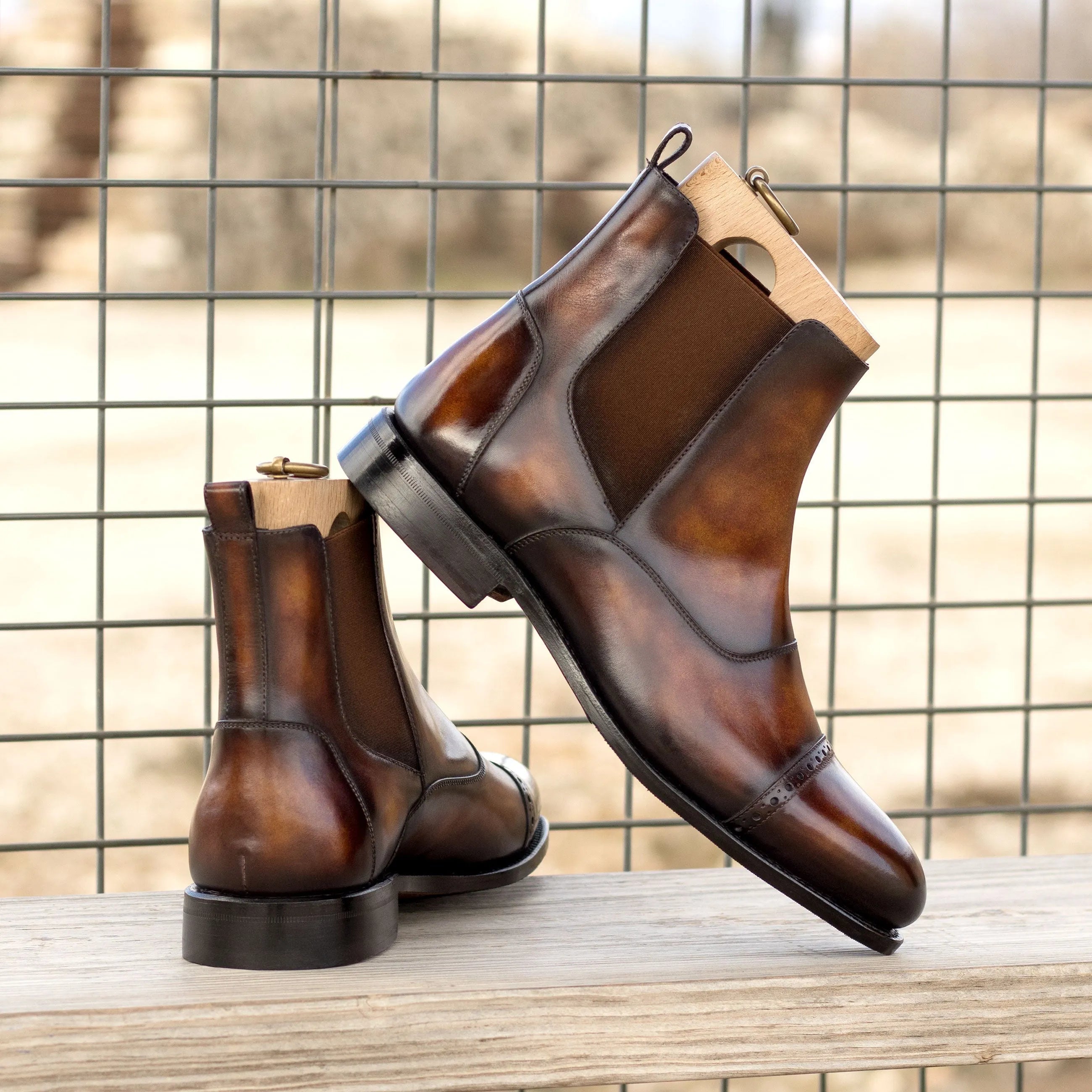 Pair of brown leather Willy Patina Chelsea boots with rounded toe design