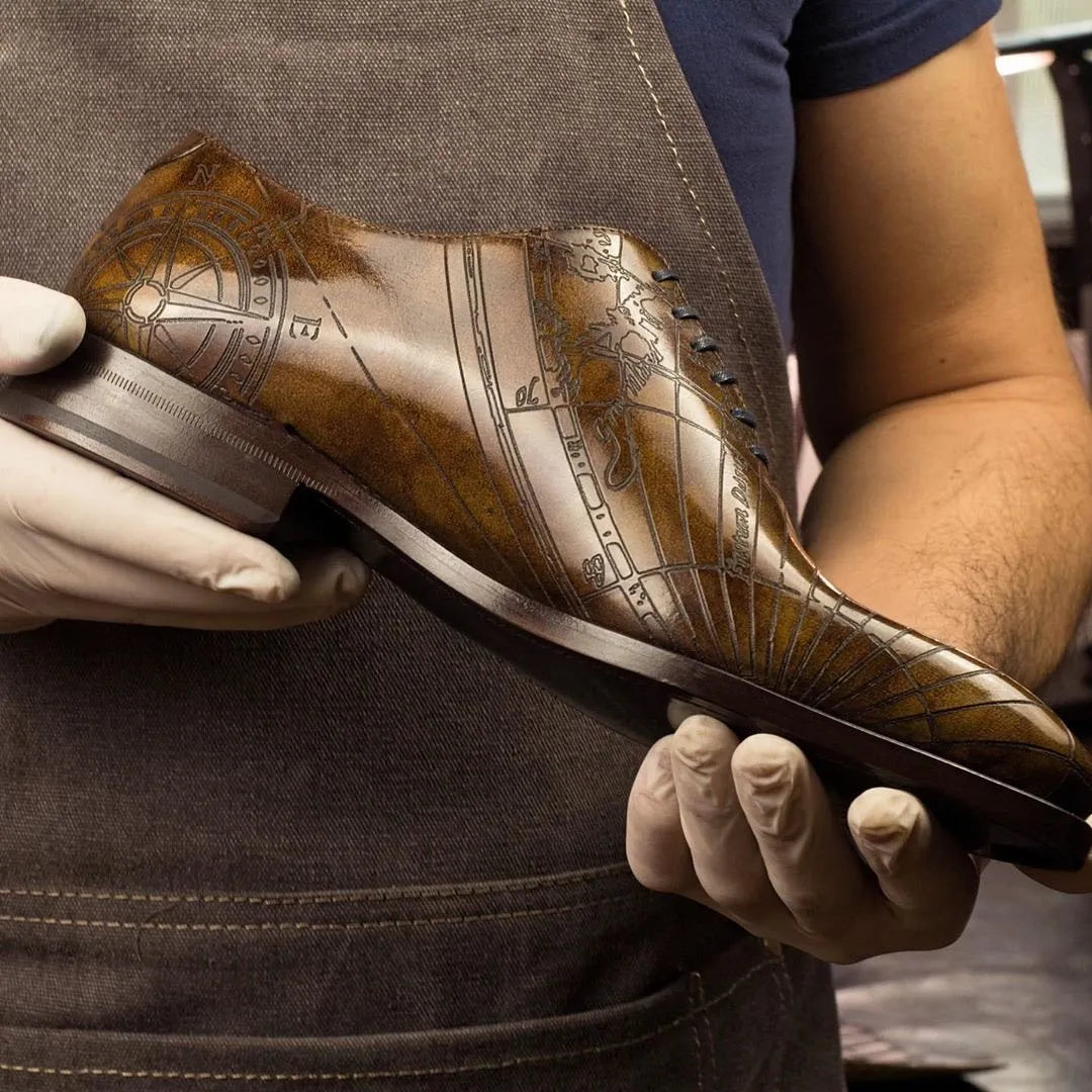 Leather dress shoe featuring a map design, Worldly Patina Wholecut in Italian Crust Leather