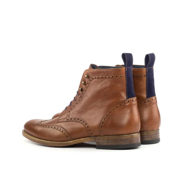 Brown leather wingtip boots from the Y03 Military Brogue collection for stylish protection